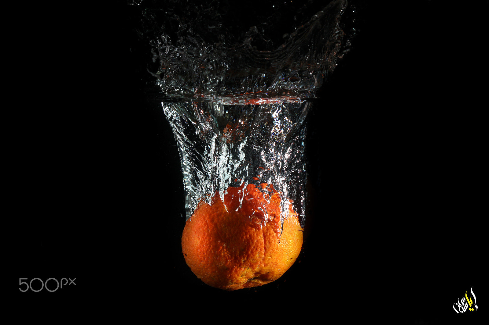 Canon EOS 700D (EOS Rebel T5i / EOS Kiss X7i) + Canon EF 100mm F2.8 Macro USM sample photo. Orange splash photography