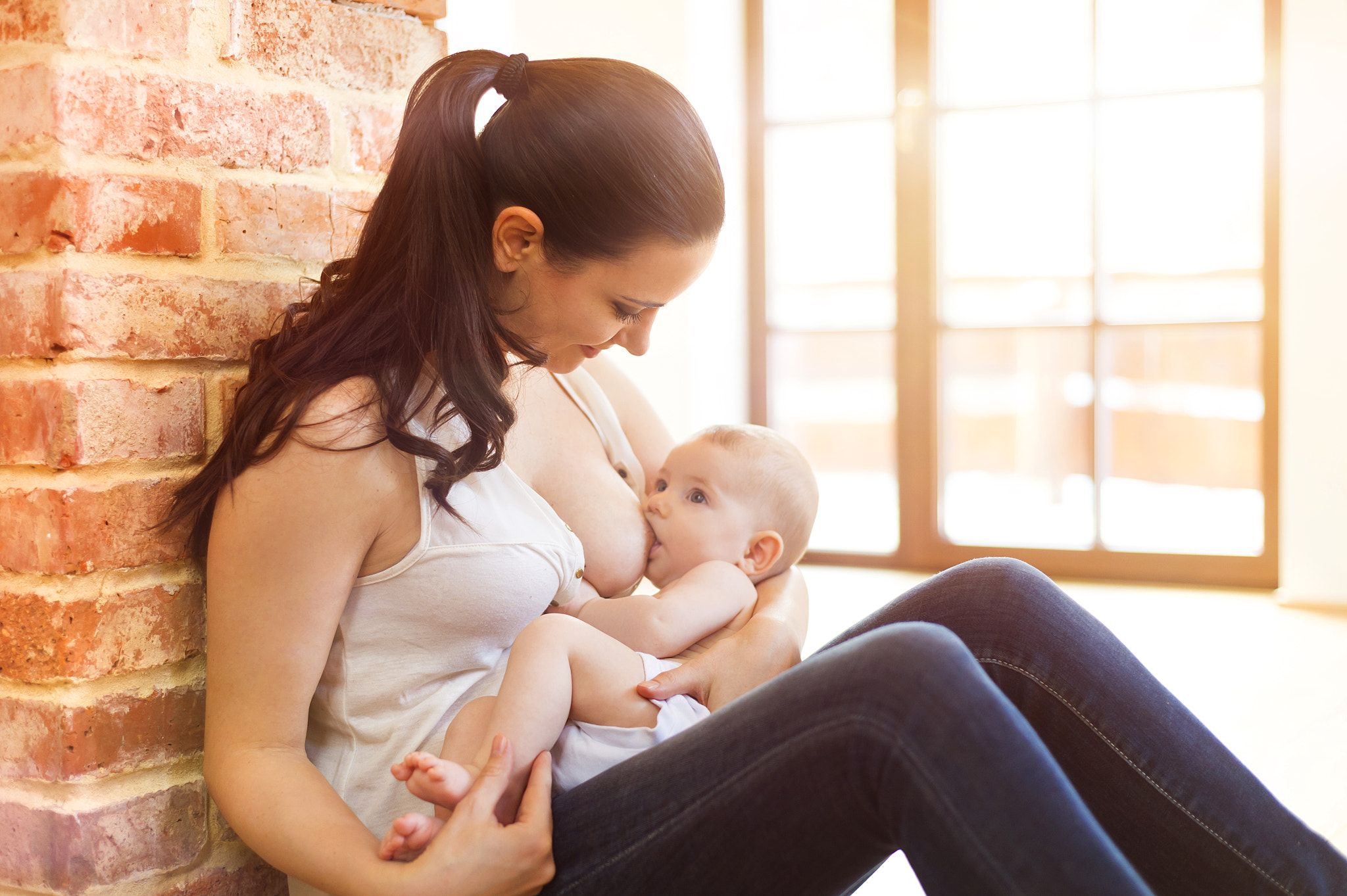 Nikon D4S + Nikon AF Nikkor 50mm F1.8D sample photo. Mother breastfeeding her baby photography