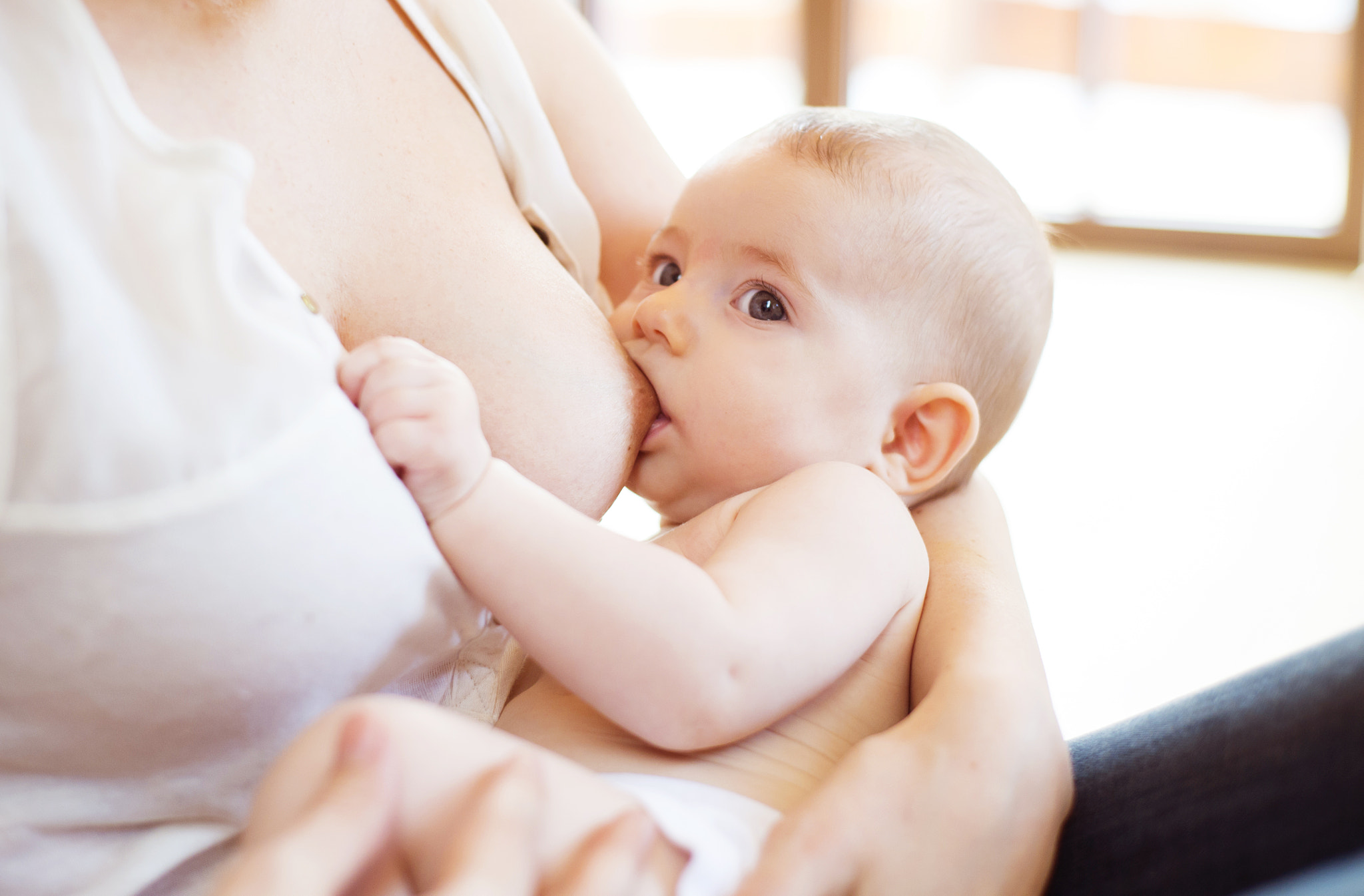 Nikon D4S + Nikon AF Nikkor 50mm F1.8D sample photo. Mother breastfeeding her baby photography