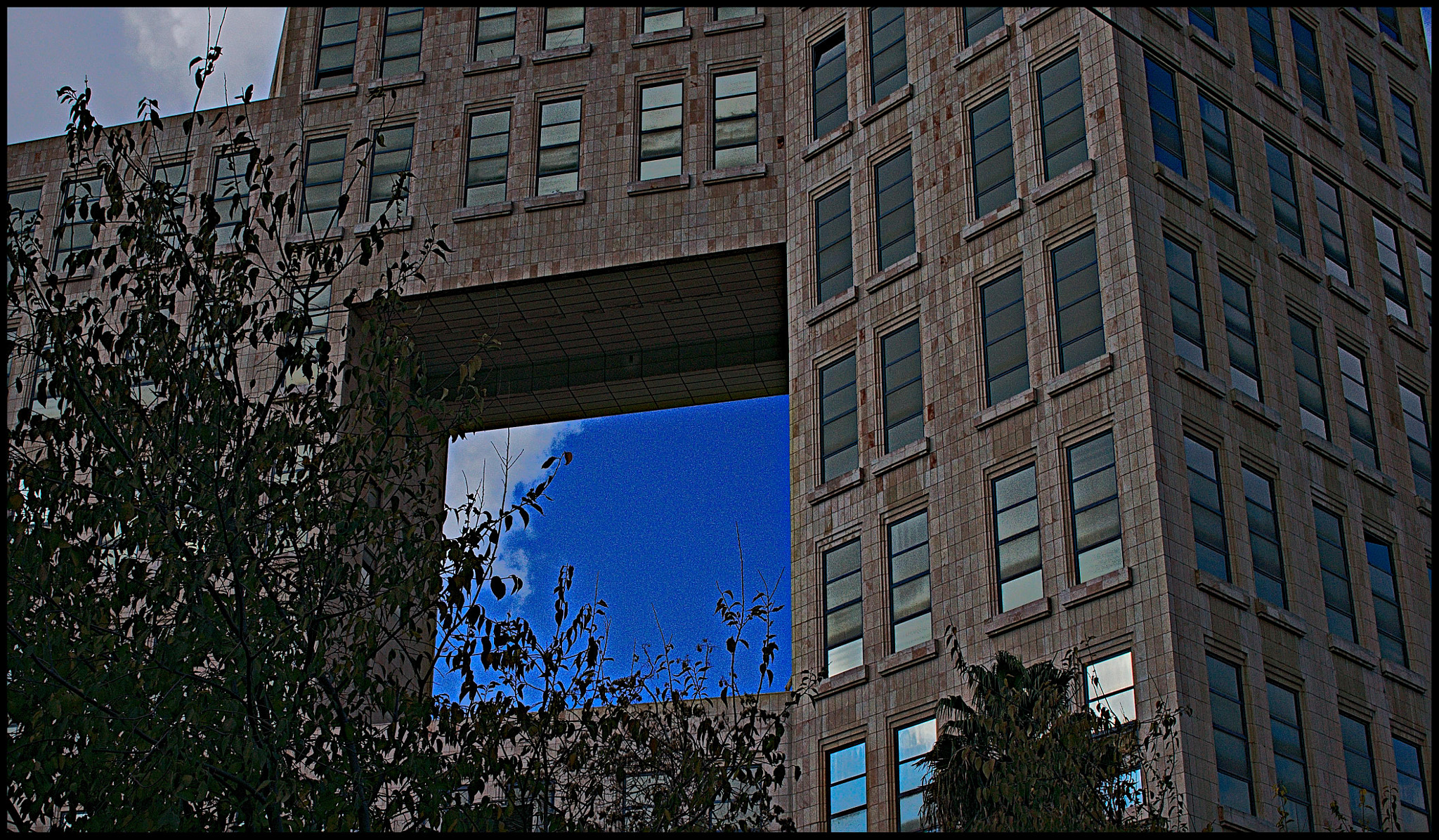 Sony Alpha NEX-5N + Sigma 30mm F2.8 EX DN sample photo. There's a hole in the building... photography