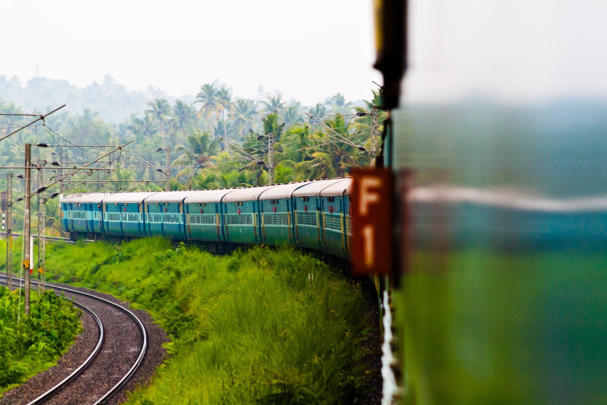 Canon EOS 400D (EOS Digital Rebel XTi / EOS Kiss Digital X) sample photo. Indian train ride in  kerala monsoon photography