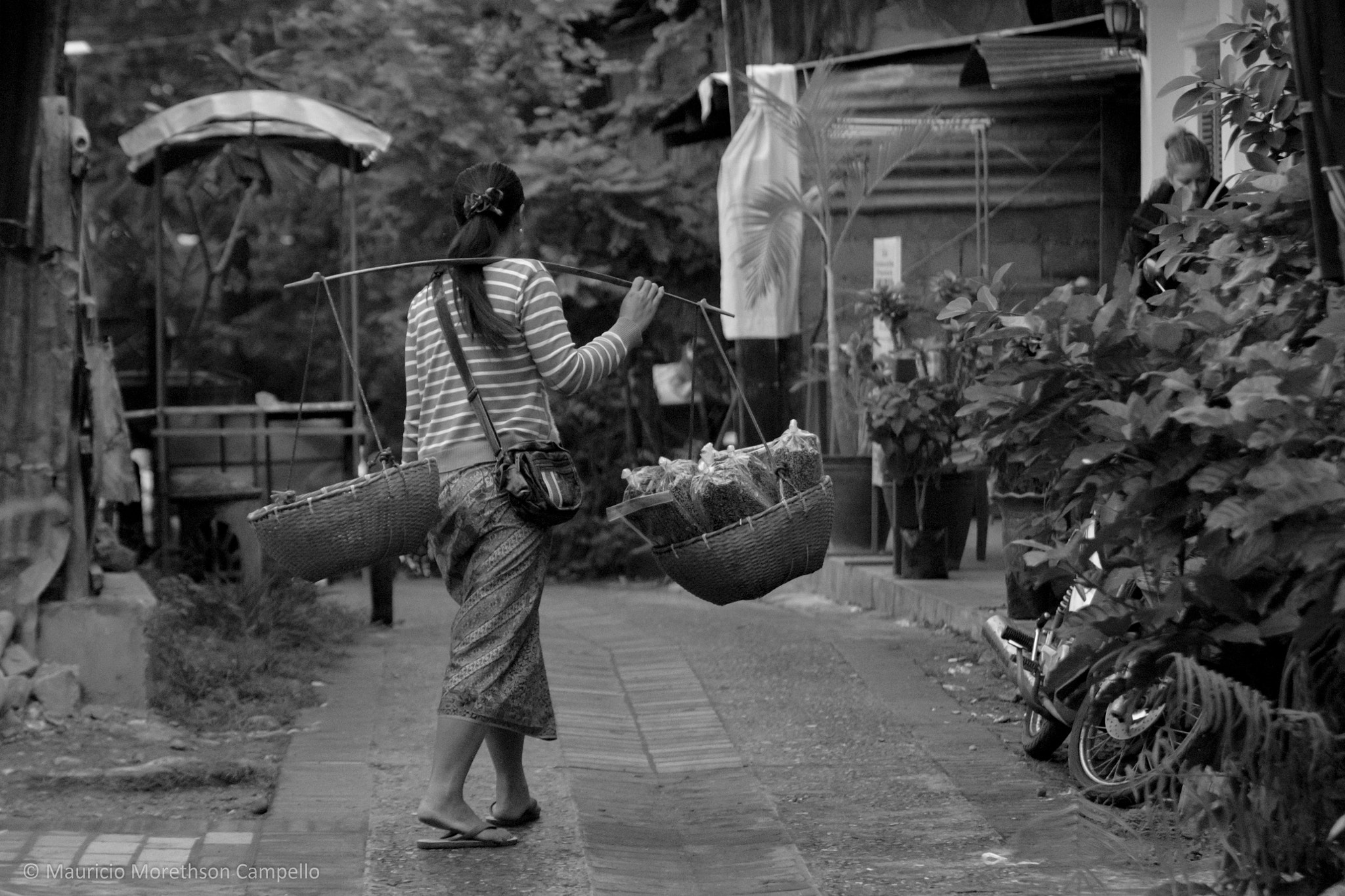 Canon EOS 650D (EOS Rebel T4i / EOS Kiss X6i) + Canon EF 70-200mm F2.8L IS II USM sample photo. Food market & woman with bamboo carrying (laos) photography