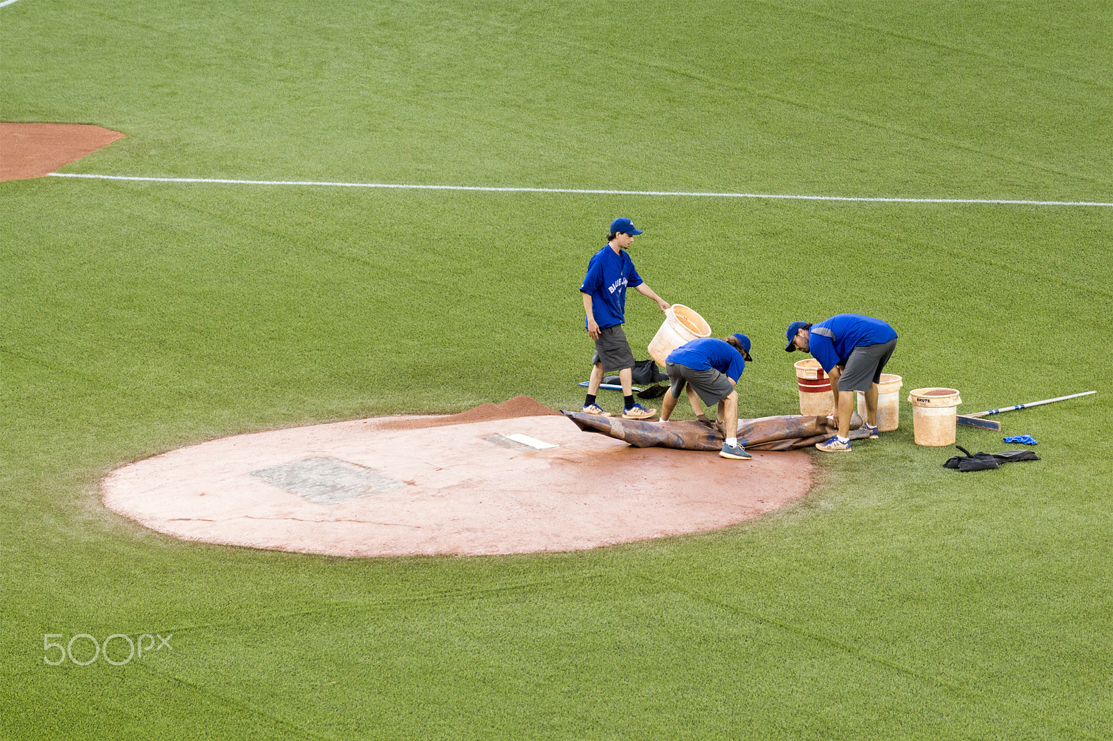 Canon EOS 650D (EOS Rebel T4i / EOS Kiss X6i) sample photo. Grounds crew removes the tarp on the pitcher's mound preparing for a baseball game at rogers centre  photography