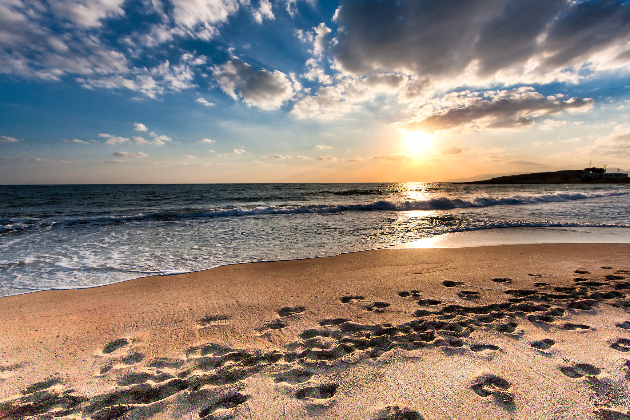 Canon EF 14mm F2.8L II USM sample photo. Cloudy sunset over a deserted beach of crete photography