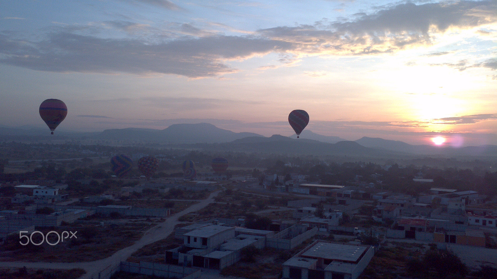 Motorola Atrix sample photo. A small town sees many big balloons uprising to sky photography