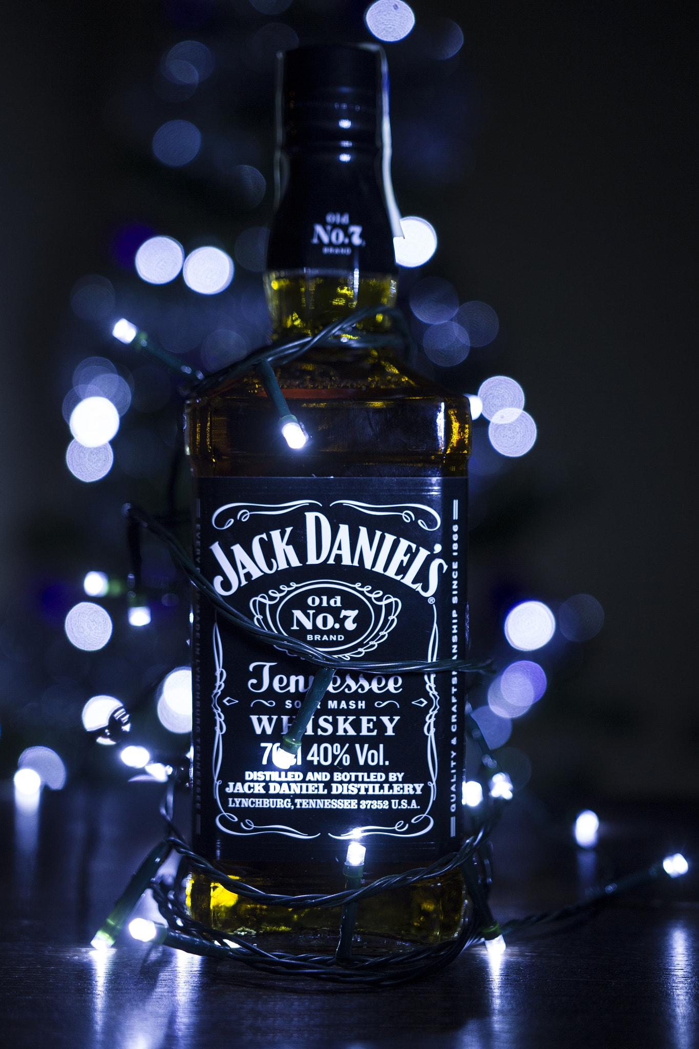 Sigma 18-35mm f/1.8 DC HSM sample photo. Jack daniels with bokeh christmas lights photography