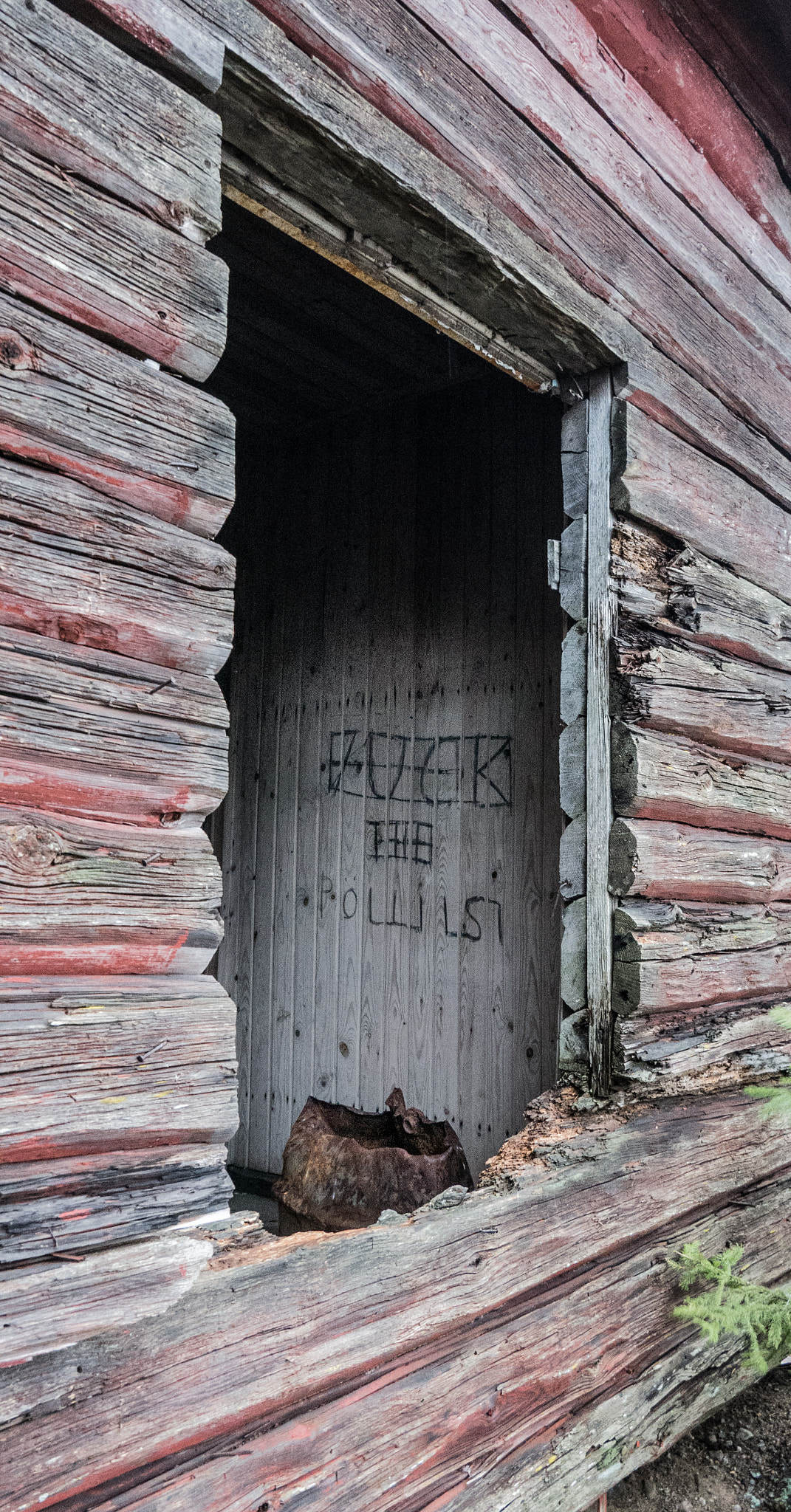LUMIX G VARIO PZ 14-42/F3.5-5.6 sample photo. Abandoned red barn with a statement on the wall photography
