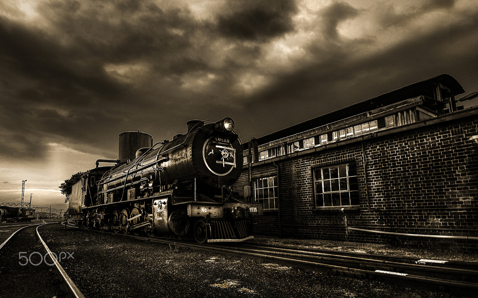 Zoom-Nikkor 1200-1700mm f/5.6-8 P ED IF sample photo. Steam train railyard tracks sepia photography