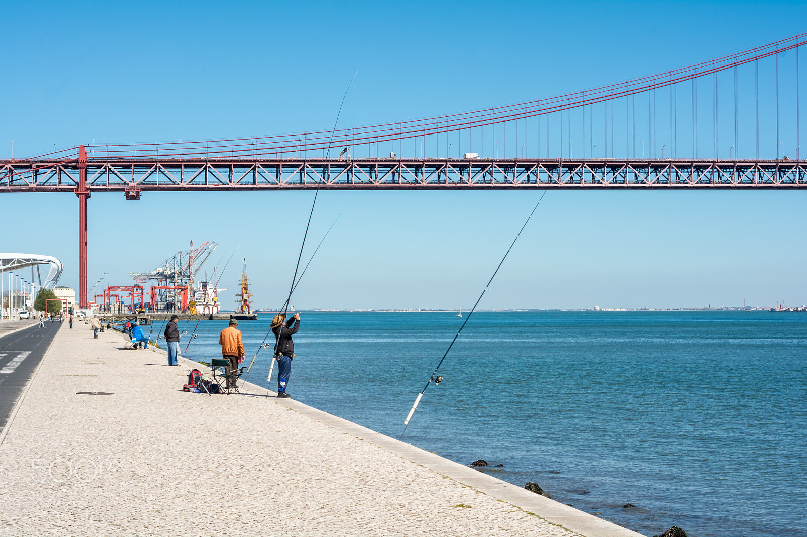 AF Zoom-Nikkor 28-80mm f/3.3-5.6G sample photo. People at a river embankment, sunny day activities photography