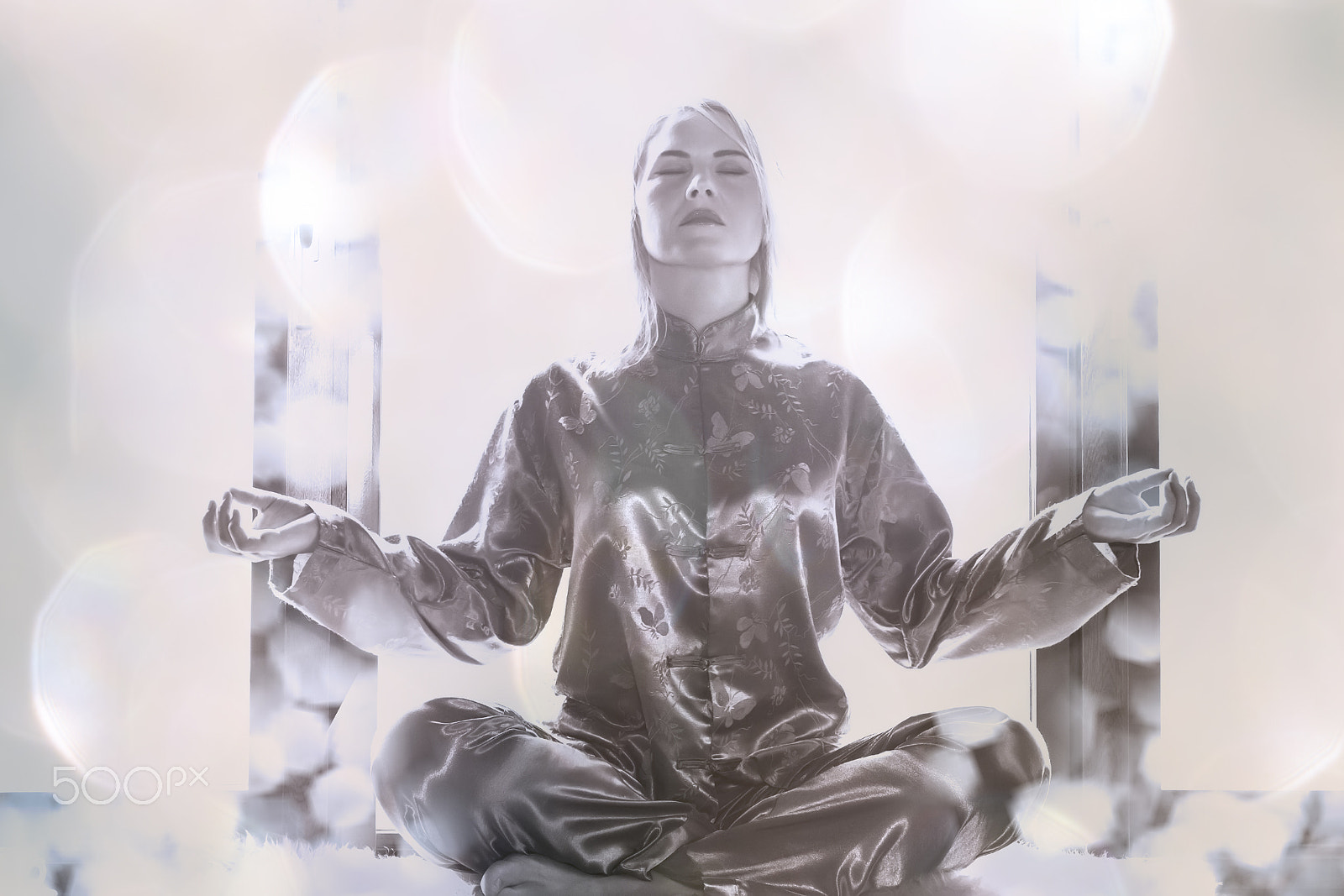 Canon EOS-1D Mark IV sample photo. Young woman in pajamas sitting in the lotus position and meditat photography