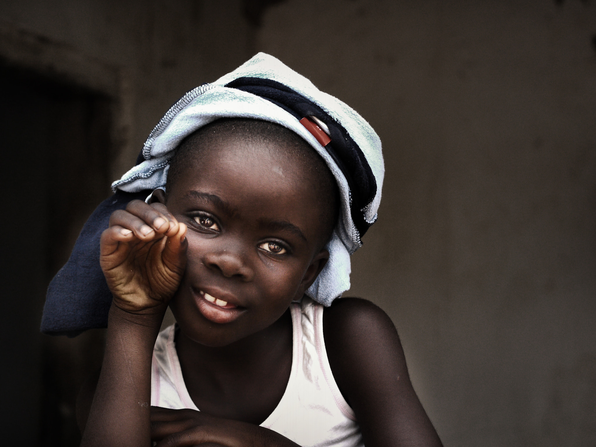 Panasonic Lumix DMC-G1 + Olympus M.Zuiko Digital 45mm F1.8 sample photo. Gambian villager photography