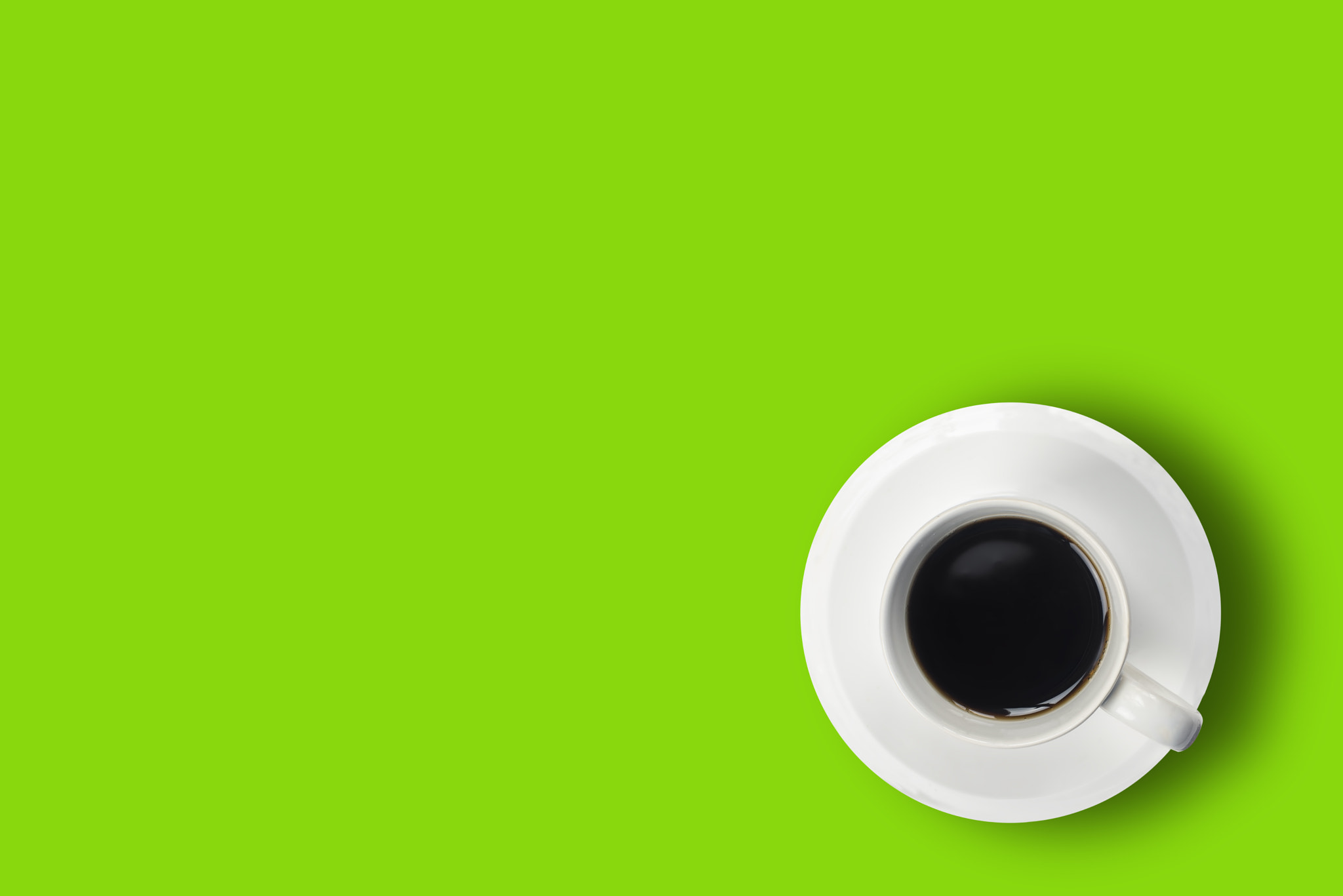 AF Micro-Nikkor 105mm f/2.8 sample photo. Black coffee in white cup on cream green  background photography