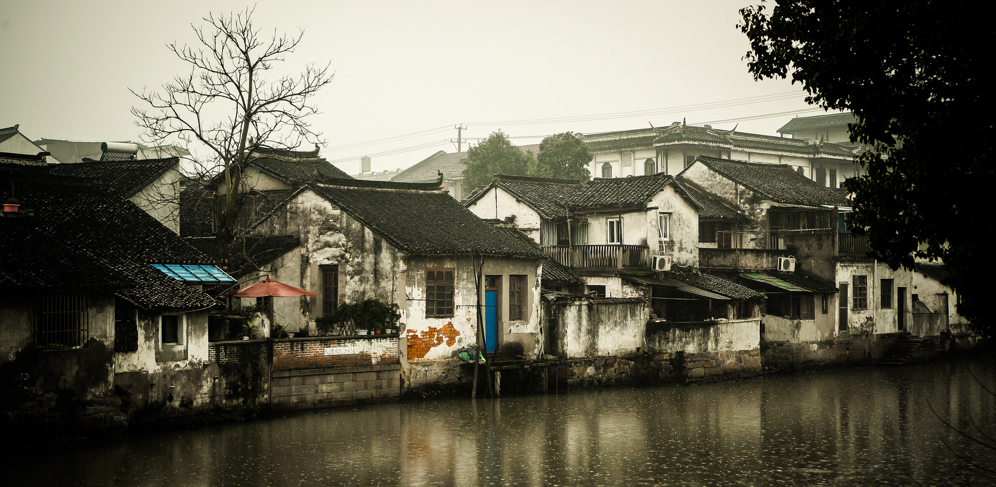 Sony Alpha NEX-5R sample photo. Old town in rain photography