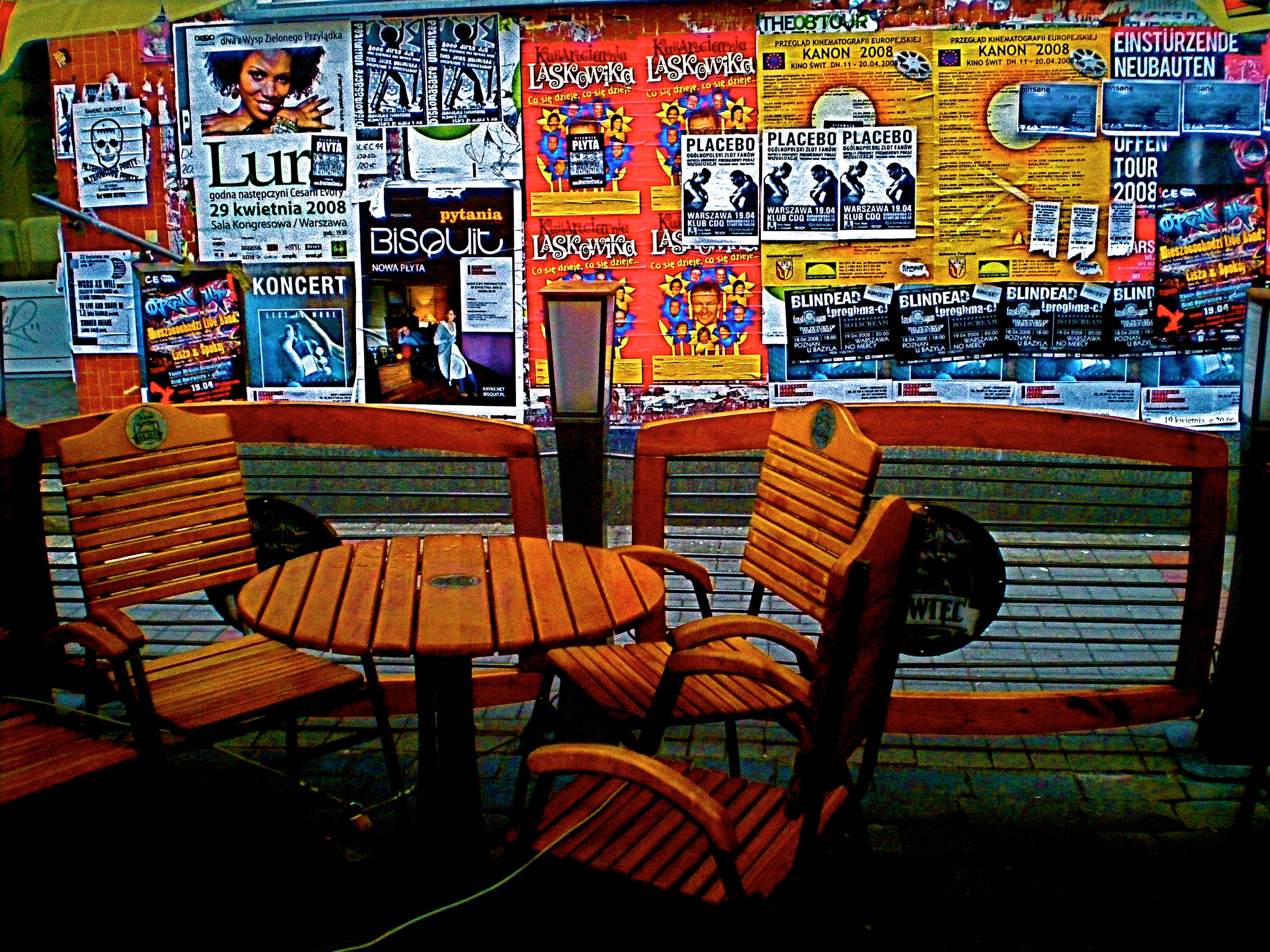 Olympus FE230/X790 sample photo. Warsaw street cafe w/ posters photography
