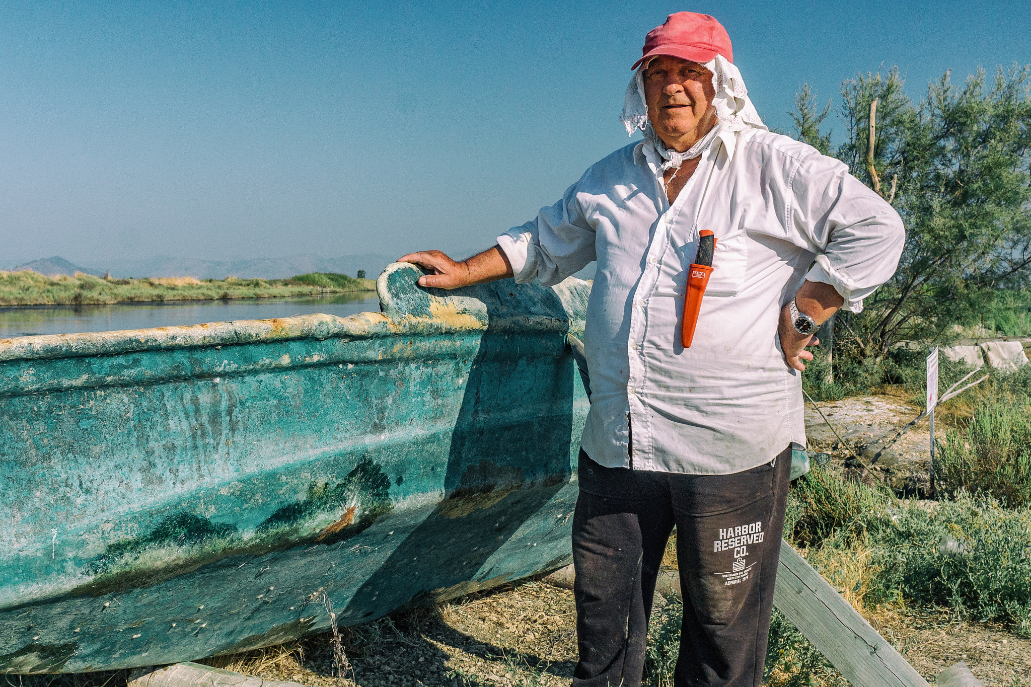 Sony SLT-A37 + Sony 28mm F2.8 sample photo. Fisherman by his boat photography
