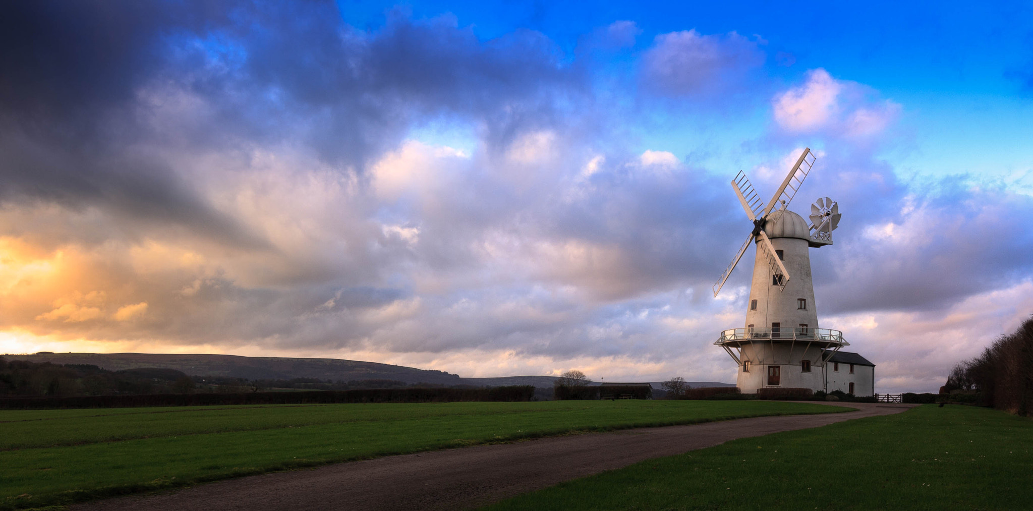 Canon EF-S 10-18mm F4.5–5.6 IS STM sample photo. Clouds & windmills photography