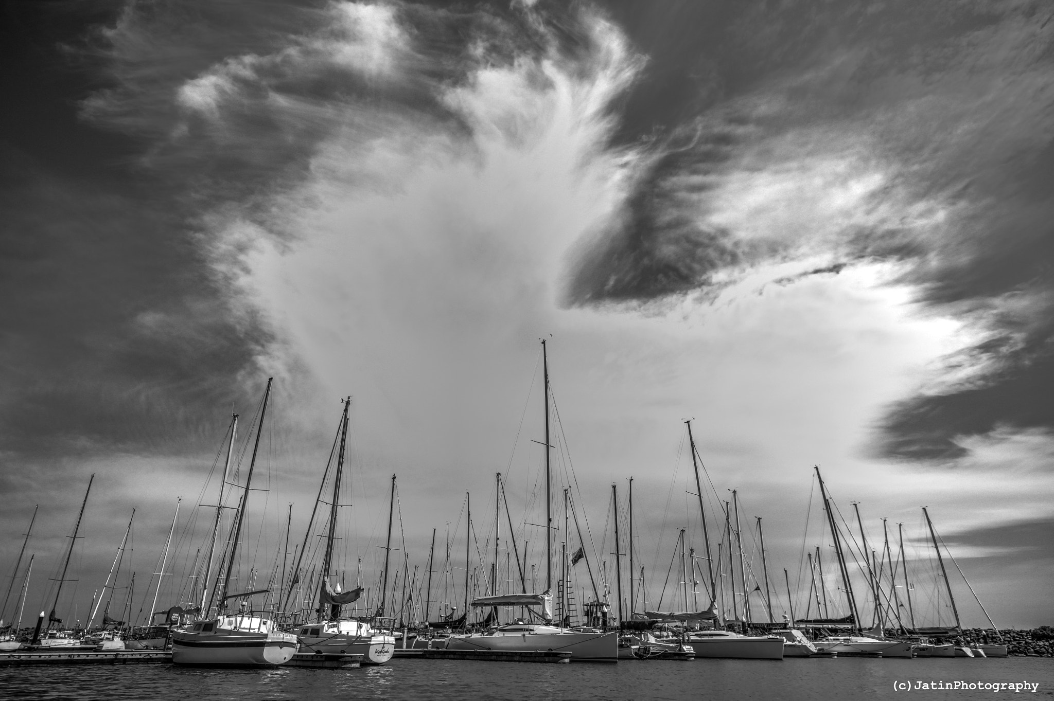 Canon EOS 500D (EOS Rebel T1i / EOS Kiss X3) + Sigma 10-20mm F4-5.6 EX DC HSM sample photo. Crazy clouds over yachts photography