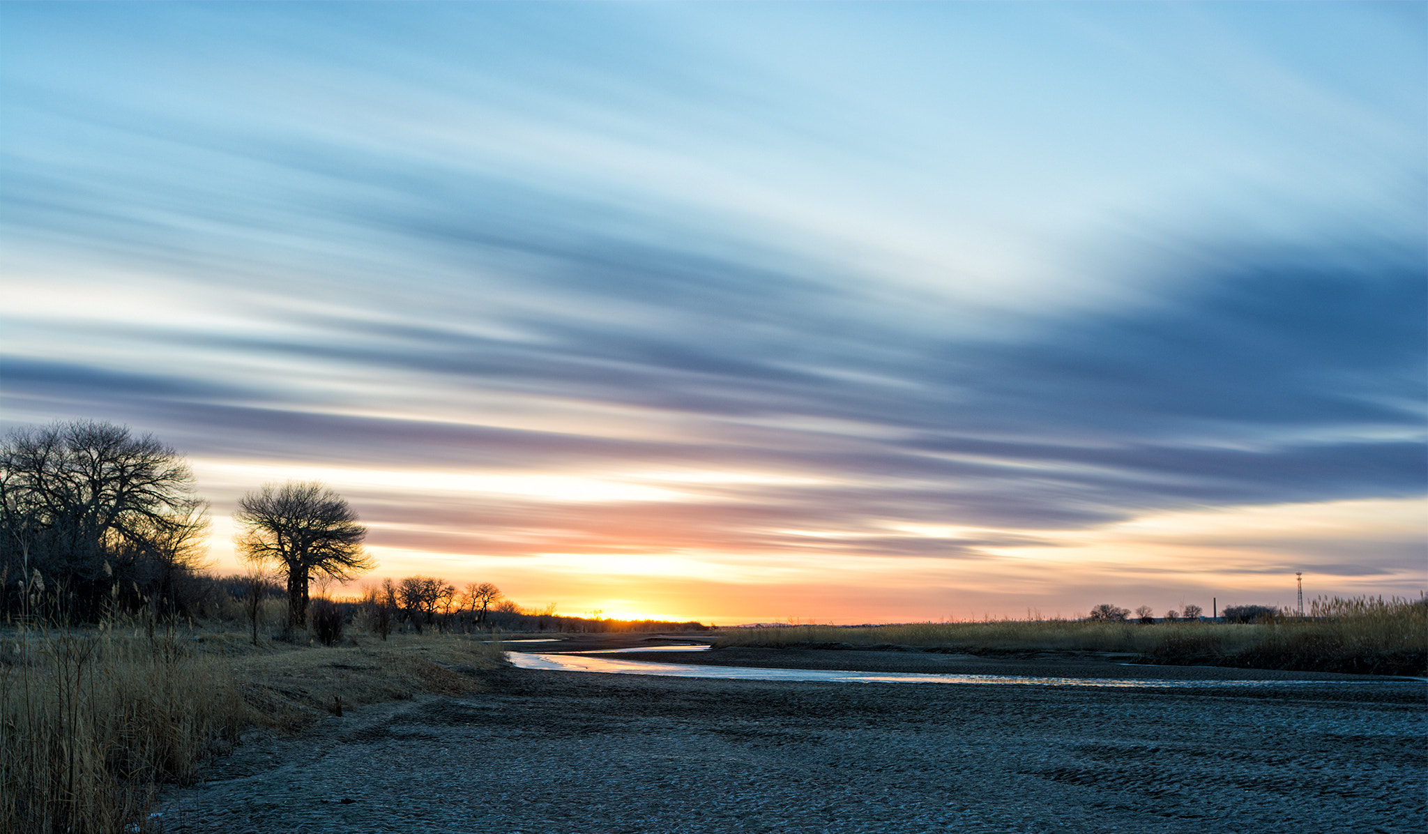 Nikon D7100 + ZEISS Distagon T* 25mm F2.8 sample photo. River under sunset photography