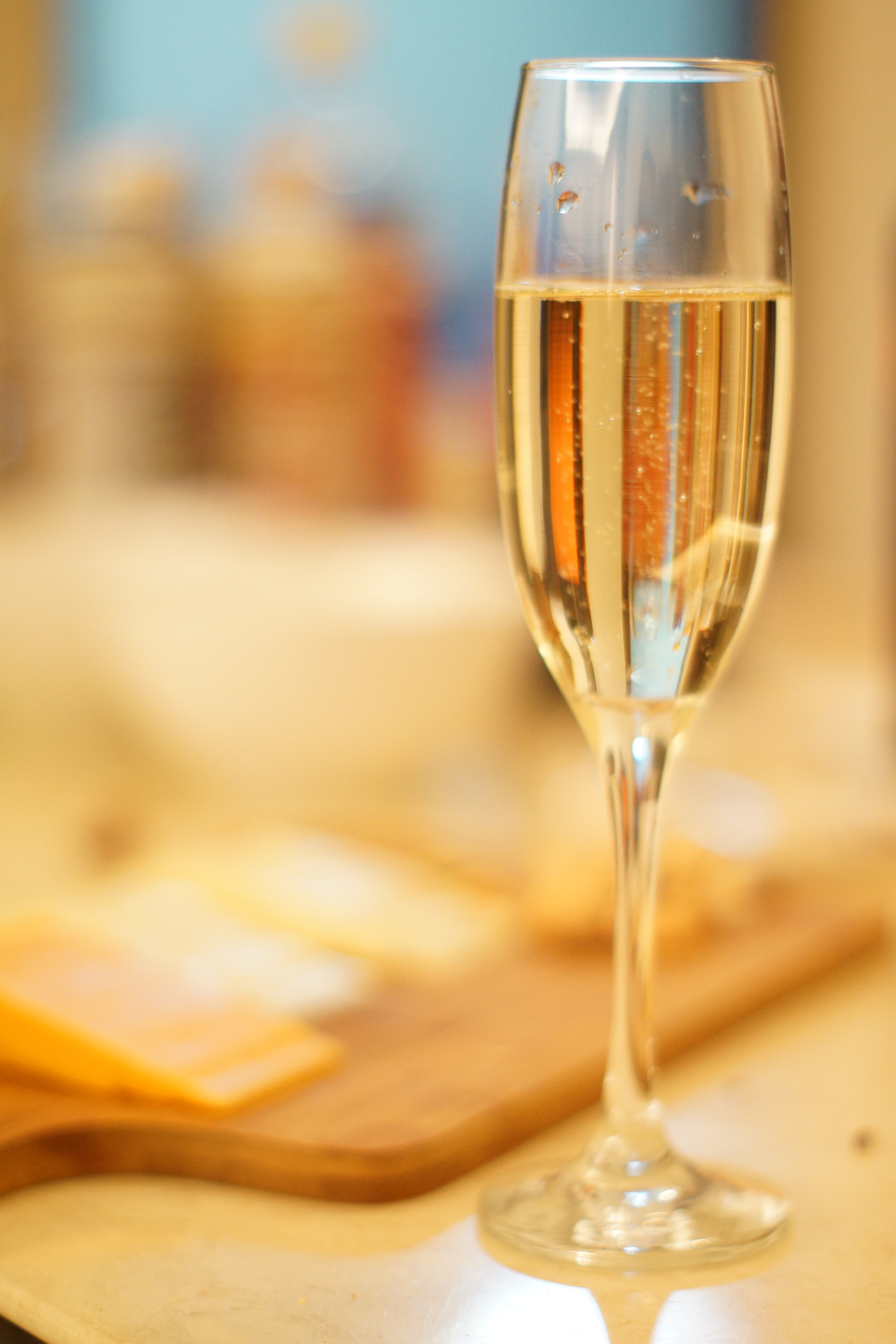 Sony SLT-A77 + Sony 50mm F1.4 sample photo. Champagne with cheese plater close up photography