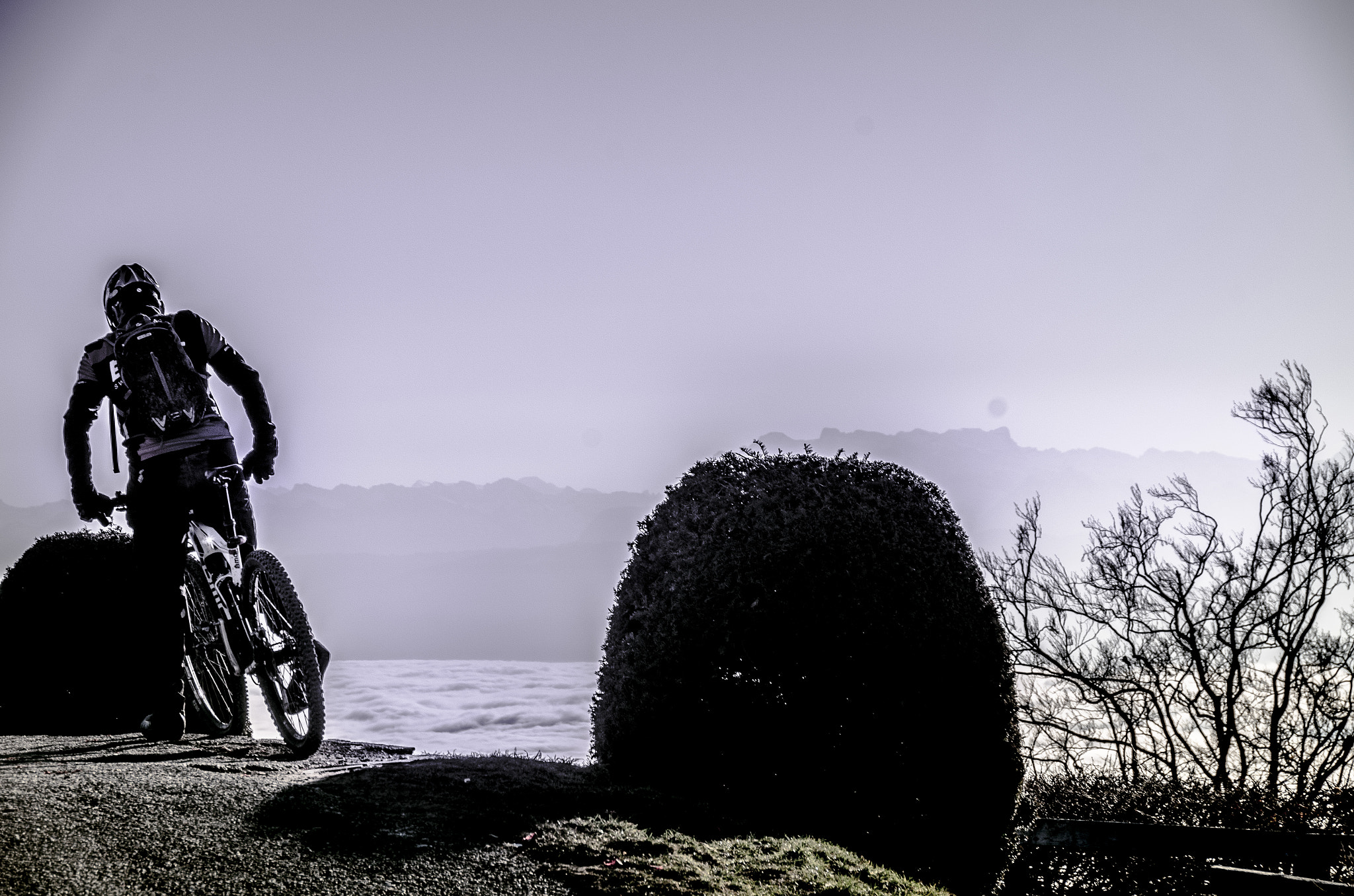 Nikon D7000 + Nikon PC-E Nikkor 24mm F3.5D ED Tilt-Shift sample photo. Biker over the clouds photography