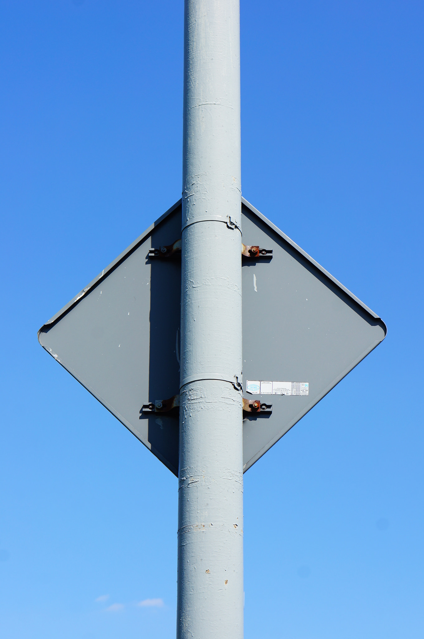 Sony Alpha NEX-5N + Sony E 50mm F1.8 OSS sample photo. Traffic sign back photography