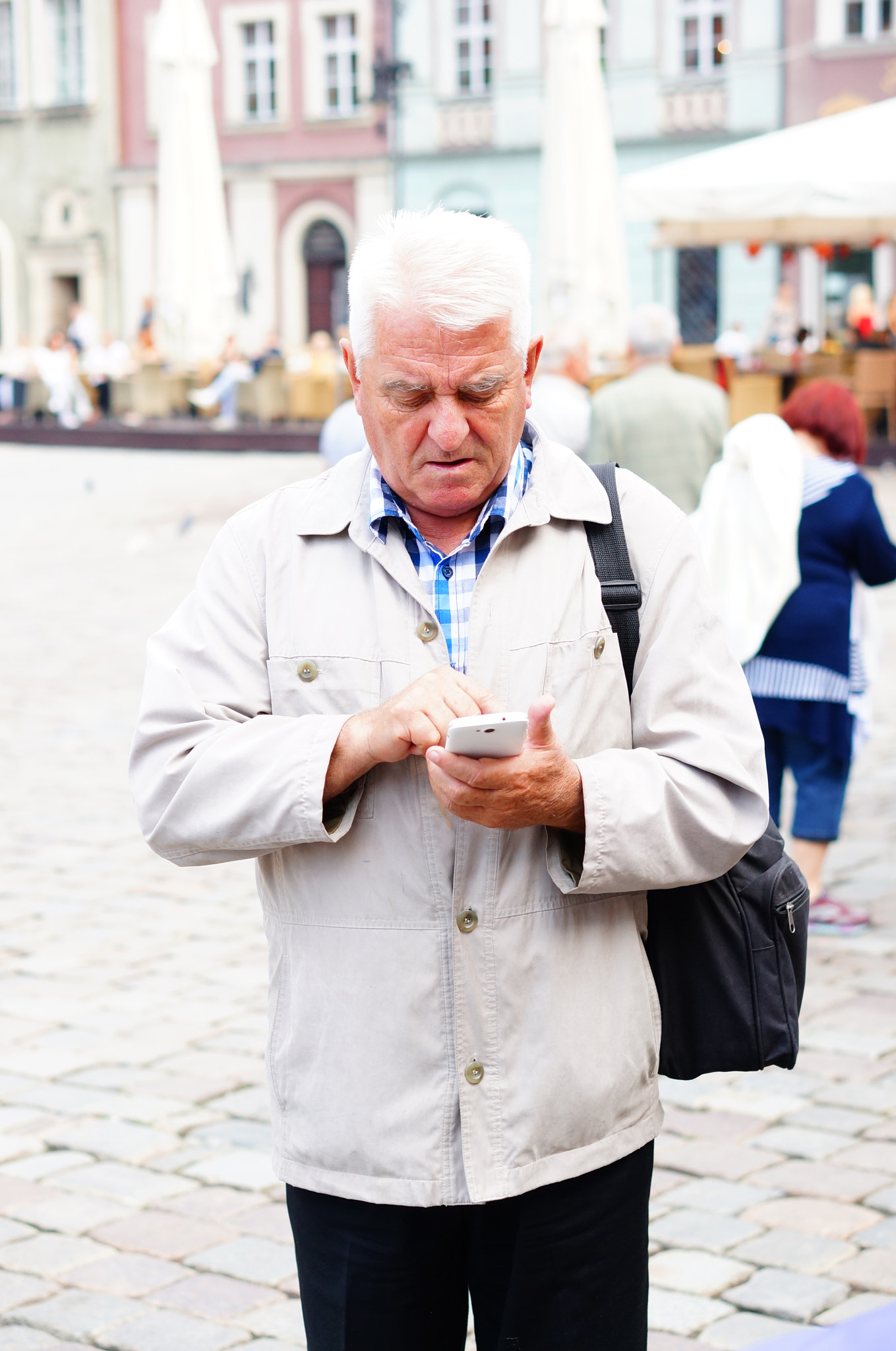 Sony Alpha NEX-6 + Sony E 50mm F1.8 OSS sample photo. Man using phone photography
