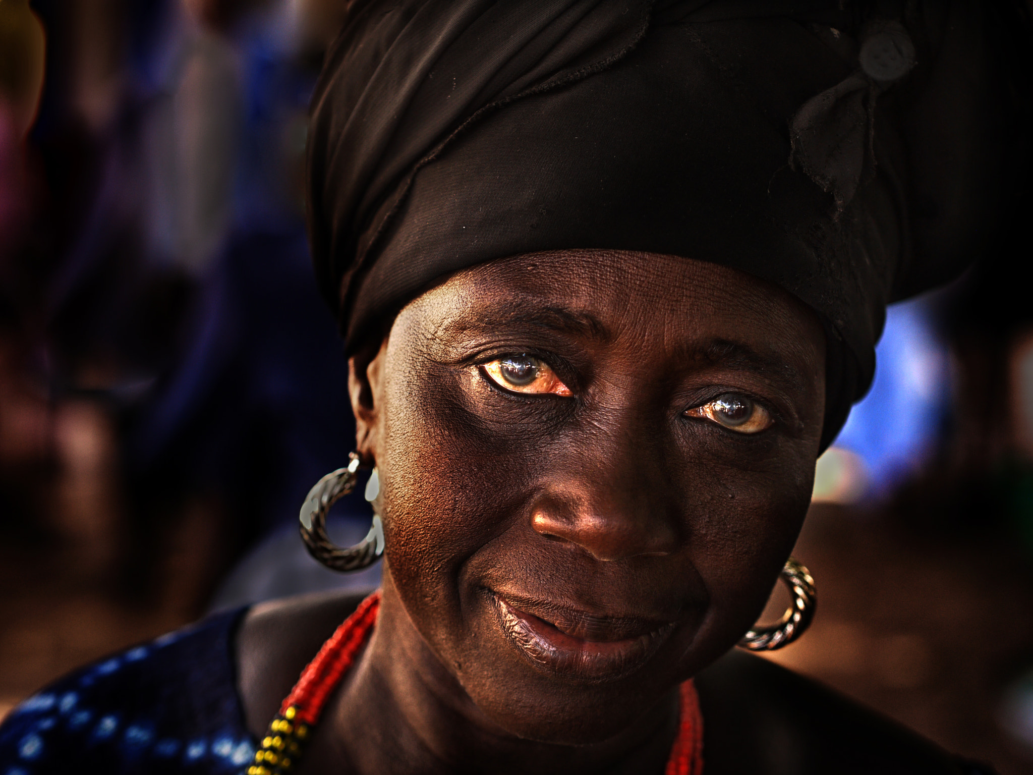 Panasonic Lumix DMC-G1 + Olympus M.Zuiko Digital 45mm F1.8 sample photo. Gambian villager photography