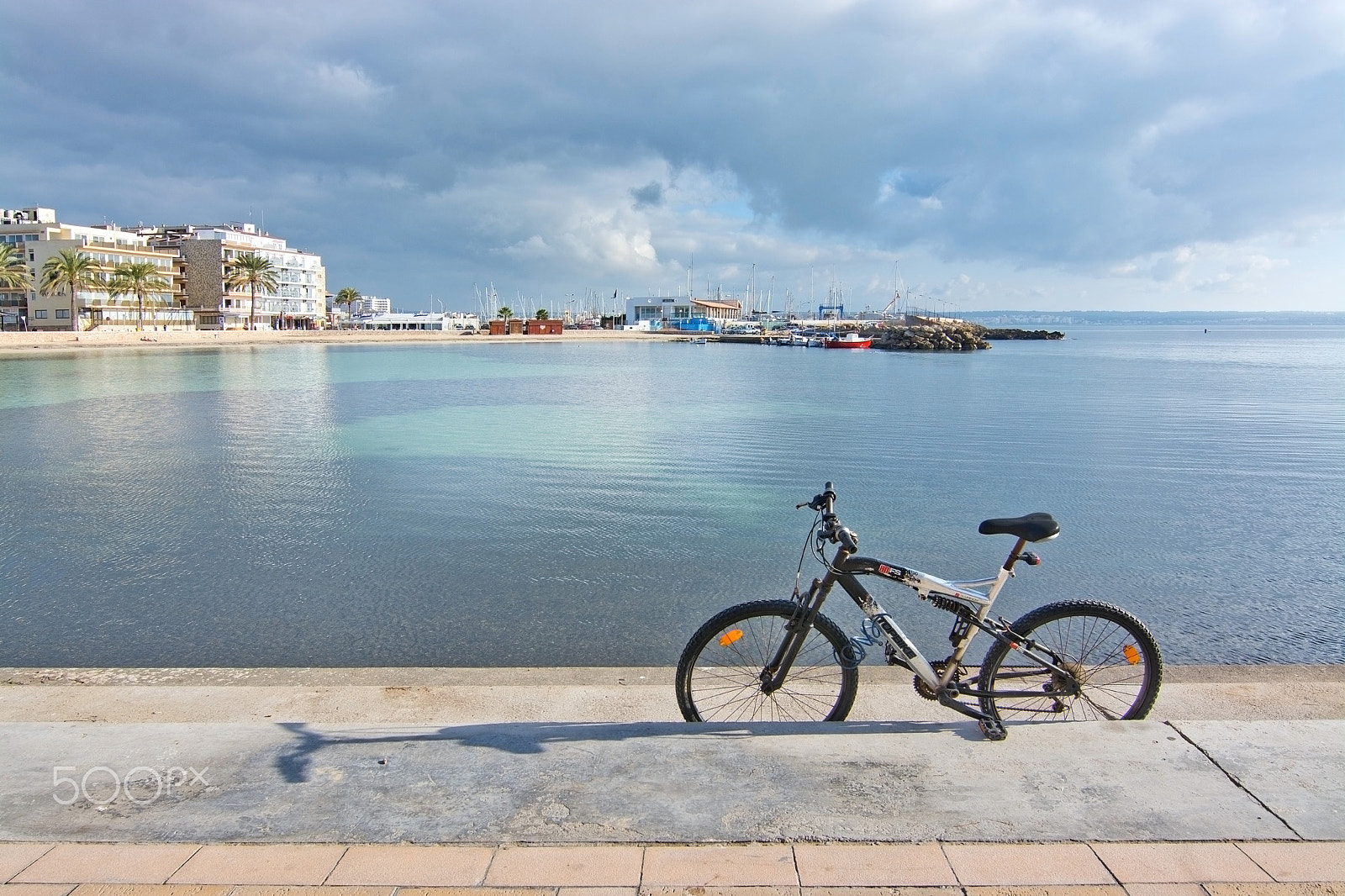 Nikon D7100 + Nikon PC-E Nikkor 24mm F3.5D ED Tilt-Shift sample photo. Bike parked on pier photography