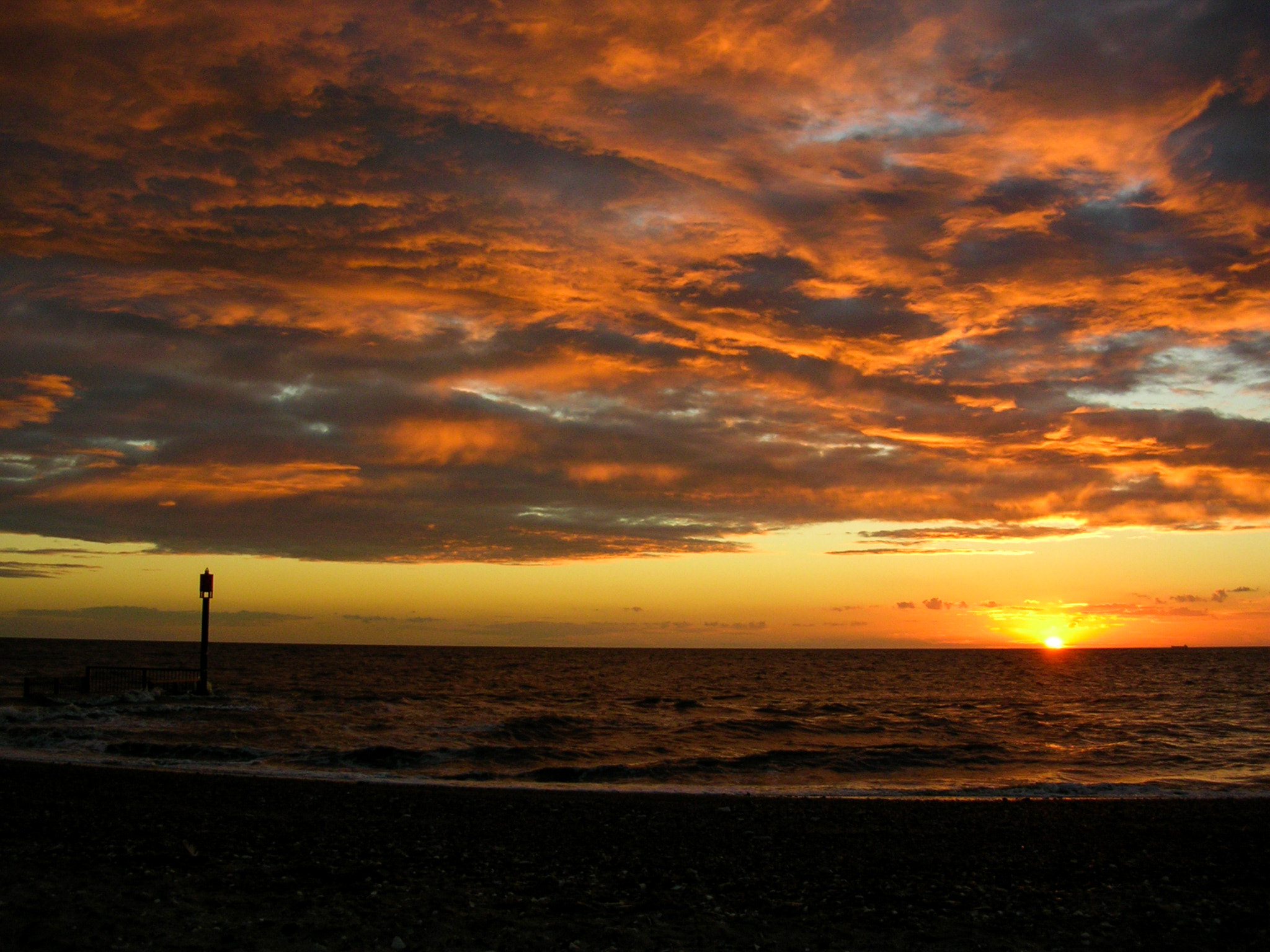 Nikon E3200 sample photo. Orange setting sea photography