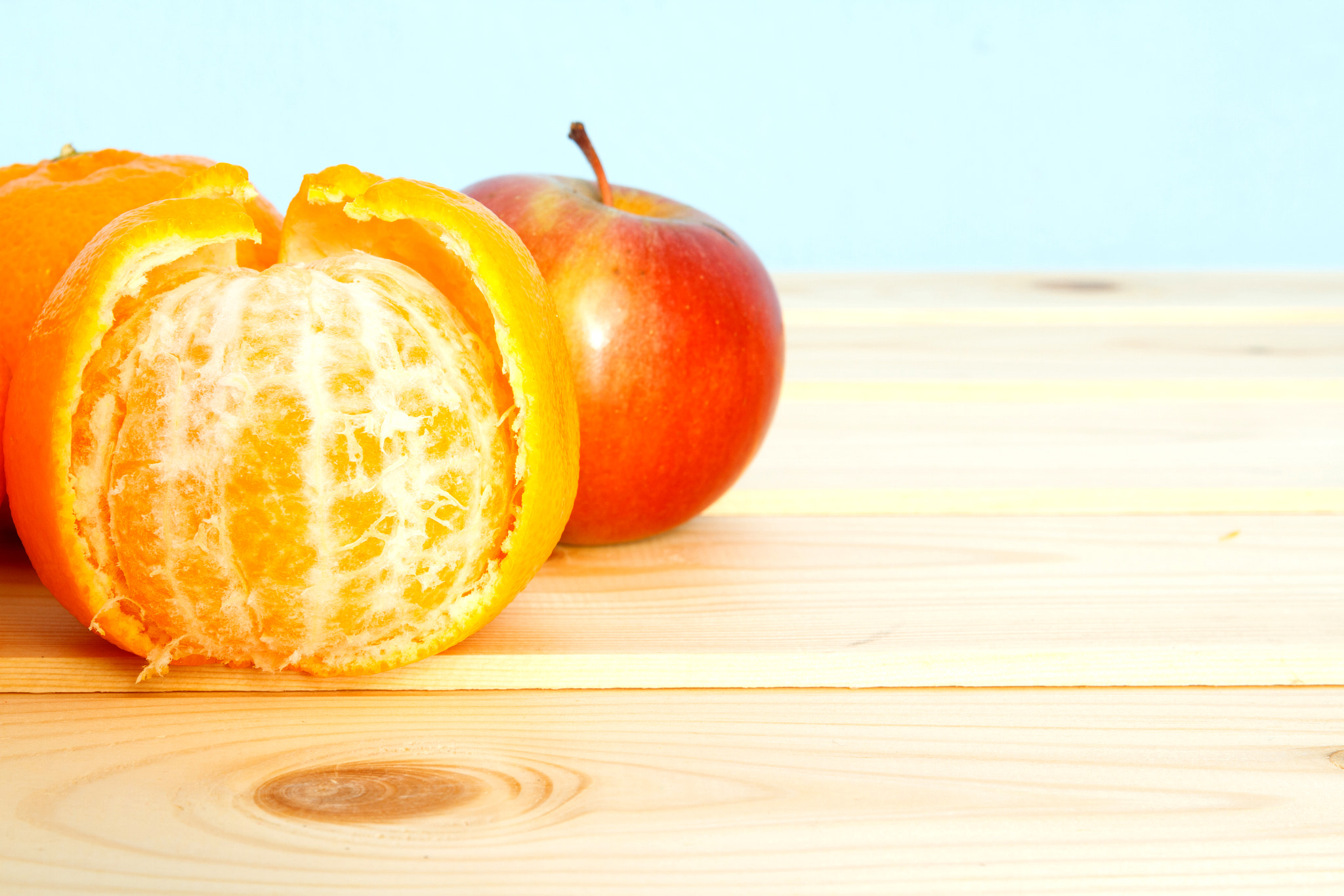 Canon EOS 7D + Canon TAMRON SP 17-50mm f/2.8 Di II VC B005 sample photo. Mandarins and apple on wooden table photography