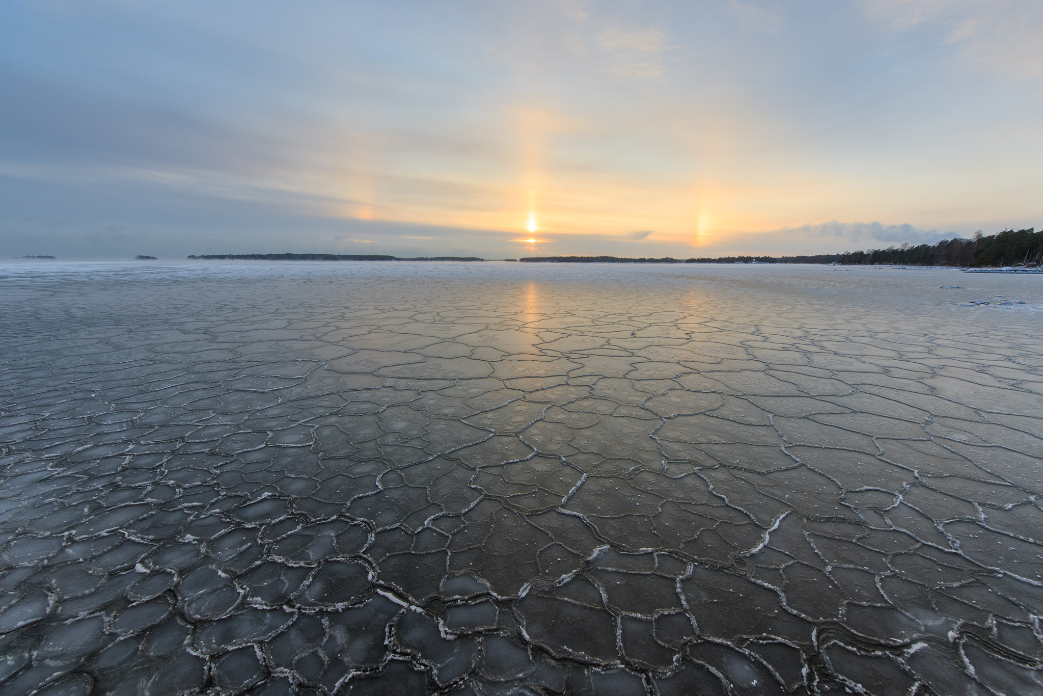 Sigma 8-16mm F4.5-5.6 DC HSM sample photo. Sunset halo over the freezing sea photography