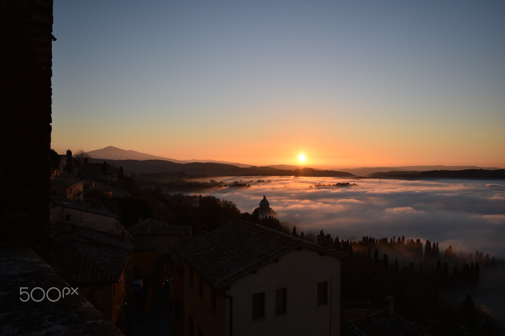 The sunset in the fog