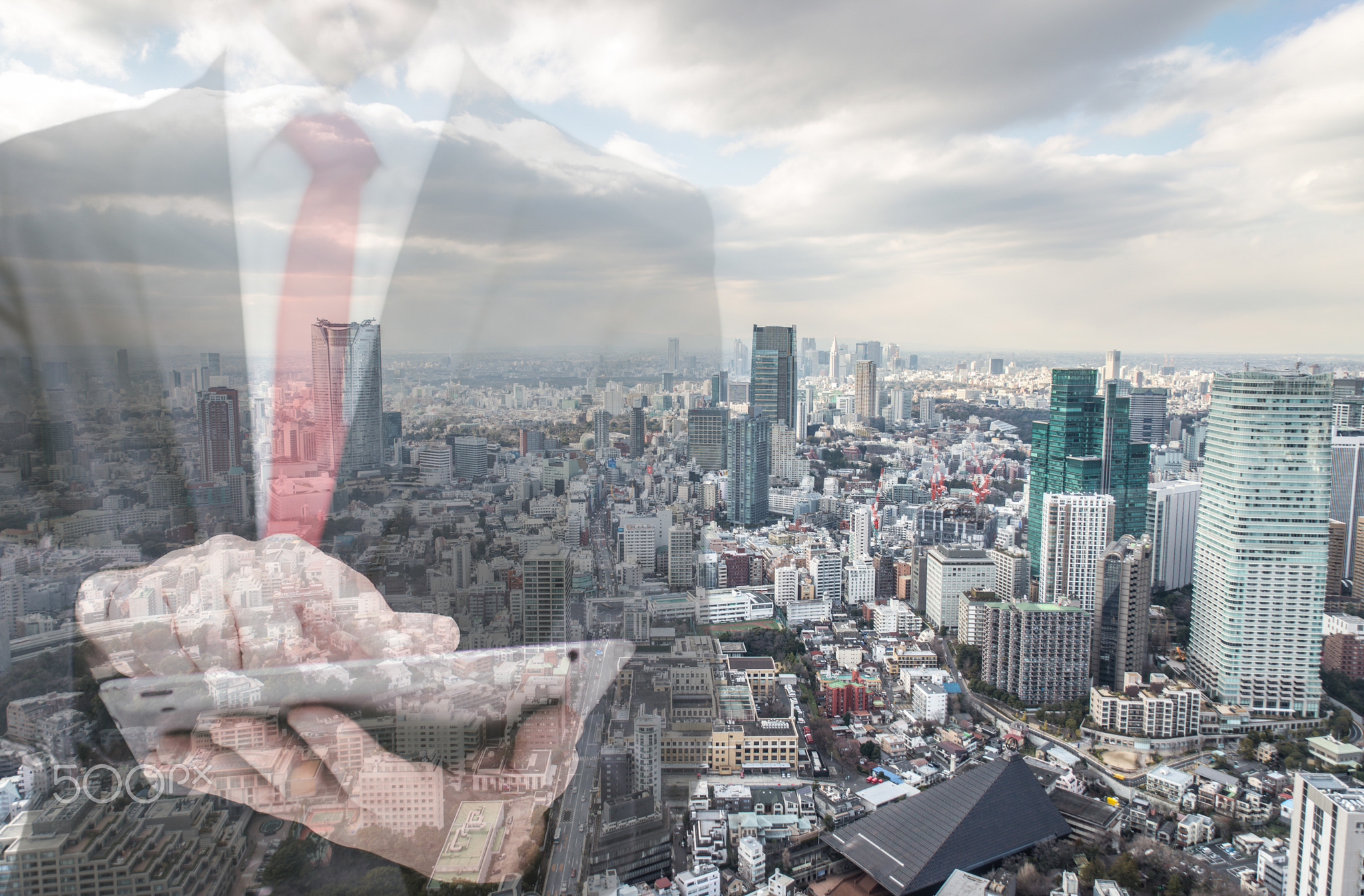 Double exposure with businessman and city skyline