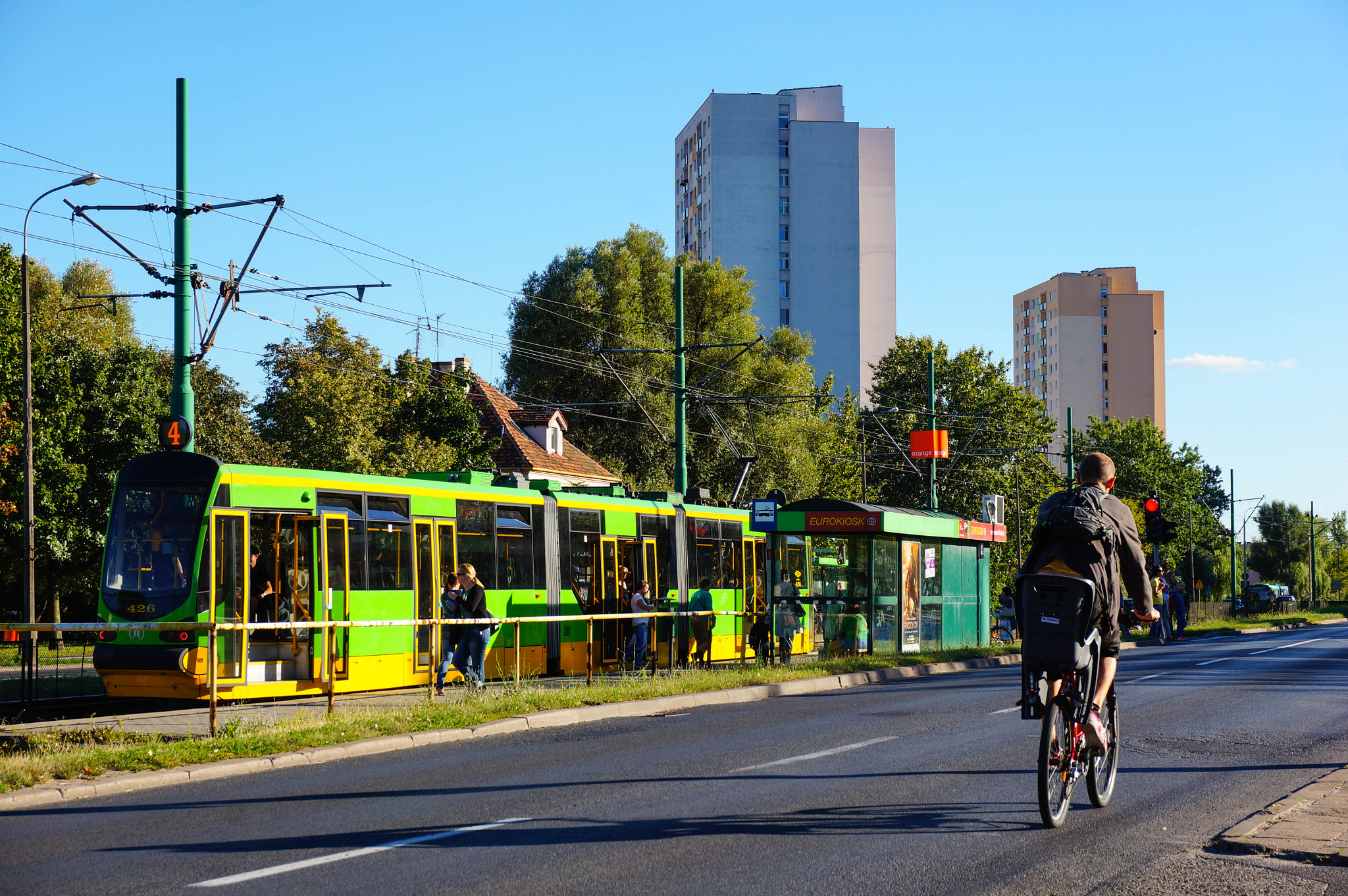 Sony Alpha NEX-5N + Sony E 16-50mm F3.5-5.6 PZ OSS sample photo. Green waiting tram photography