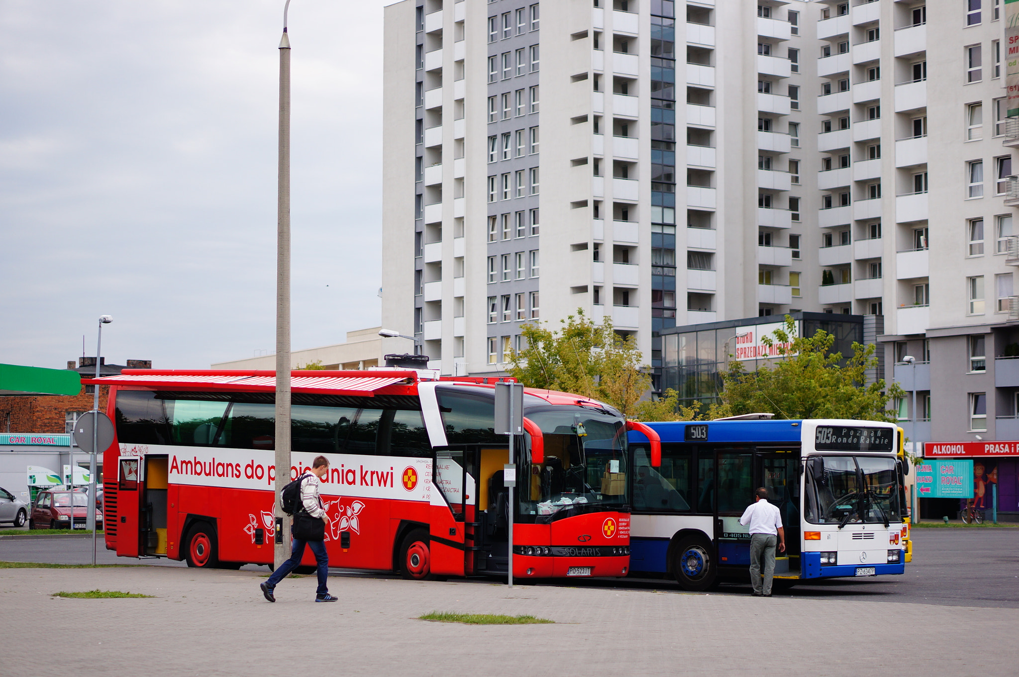 Sony Alpha NEX-5N + Sony E 50mm F1.8 OSS sample photo. Two busses standing by the rataje station in poznan, poland photography