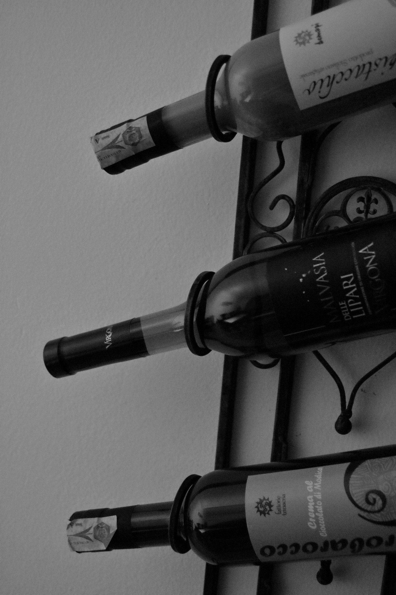 Canon EOS 760D (EOS Rebel T6s / EOS 8000D) + Sigma 28-80mm f/3.5-5.6 II Macro sample photo. B&w bottle rack photography