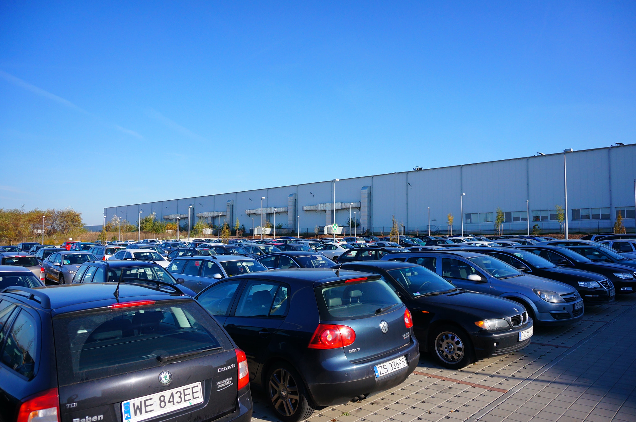 Sony E 16-50mm F3.5-5.6 PZ OSS sample photo. Gadki, poland - october 31, 2013: parked cars of employees by the transport company raben polska photography