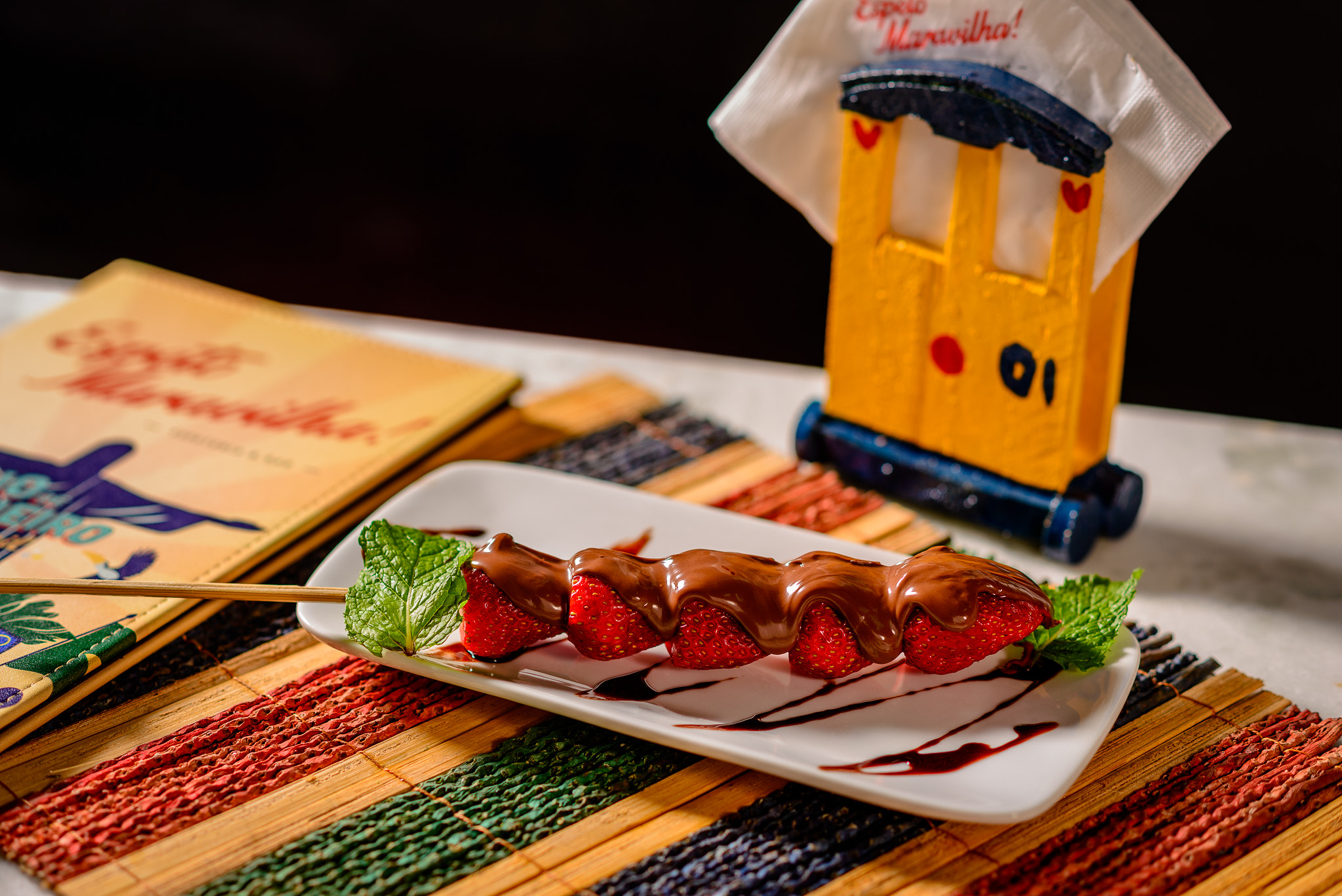 Nikon D610 + AF Nikkor 85mm f/1.8 sample photo. Strawberries and chocolate stick photography