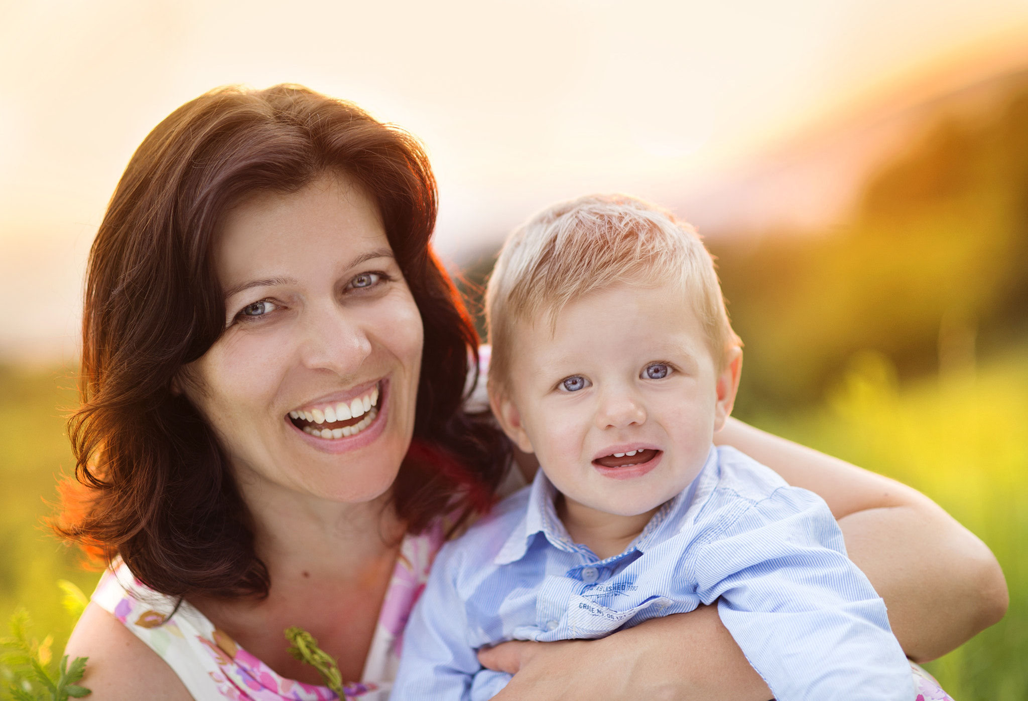 Nikon D4S + Nikon AF Nikkor 85mm F1.8D sample photo. Mother with little son relaxing together in nature photography