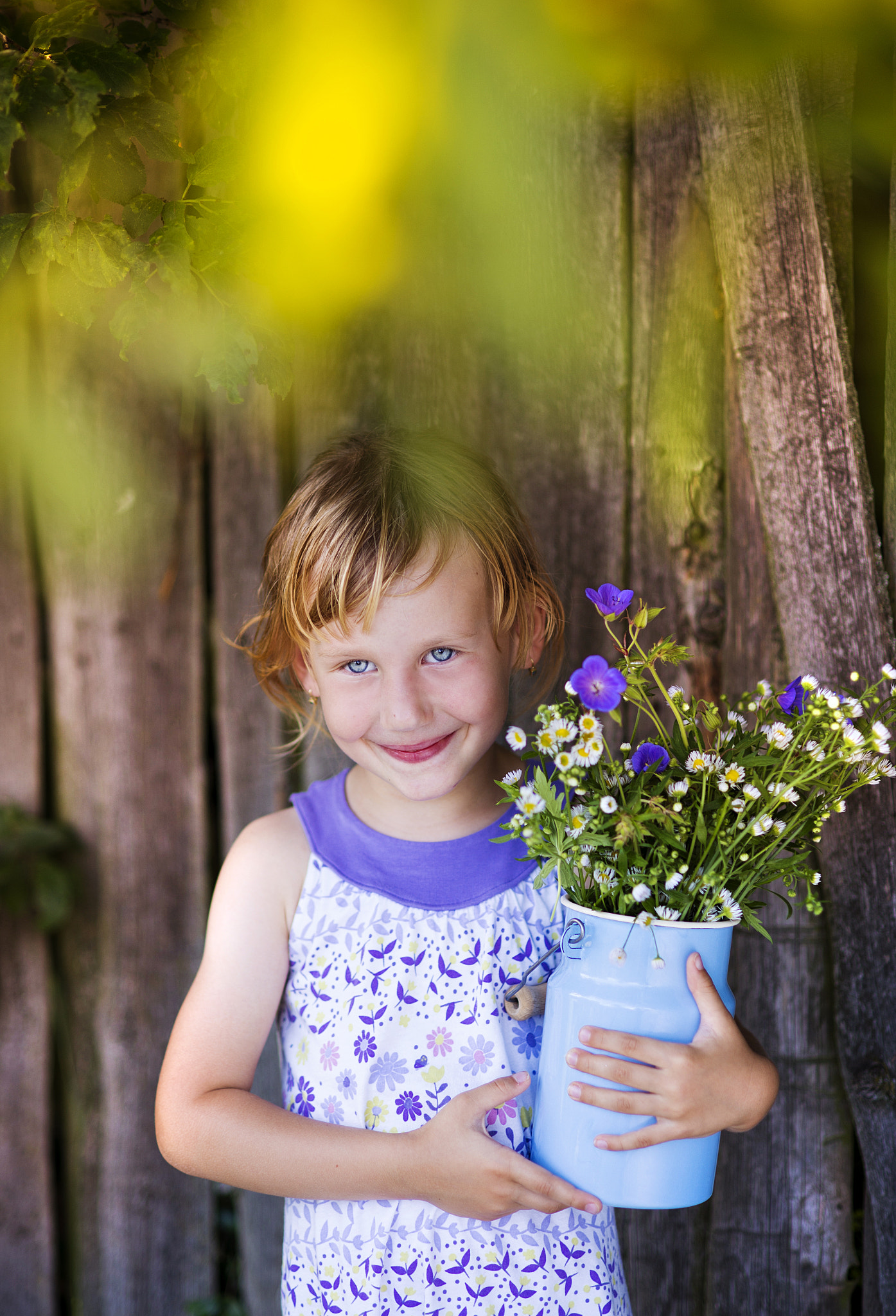 Nikon D4S + Nikon AF Nikkor 85mm F1.8D sample photo. Cute little girl with flowers laughing photography
