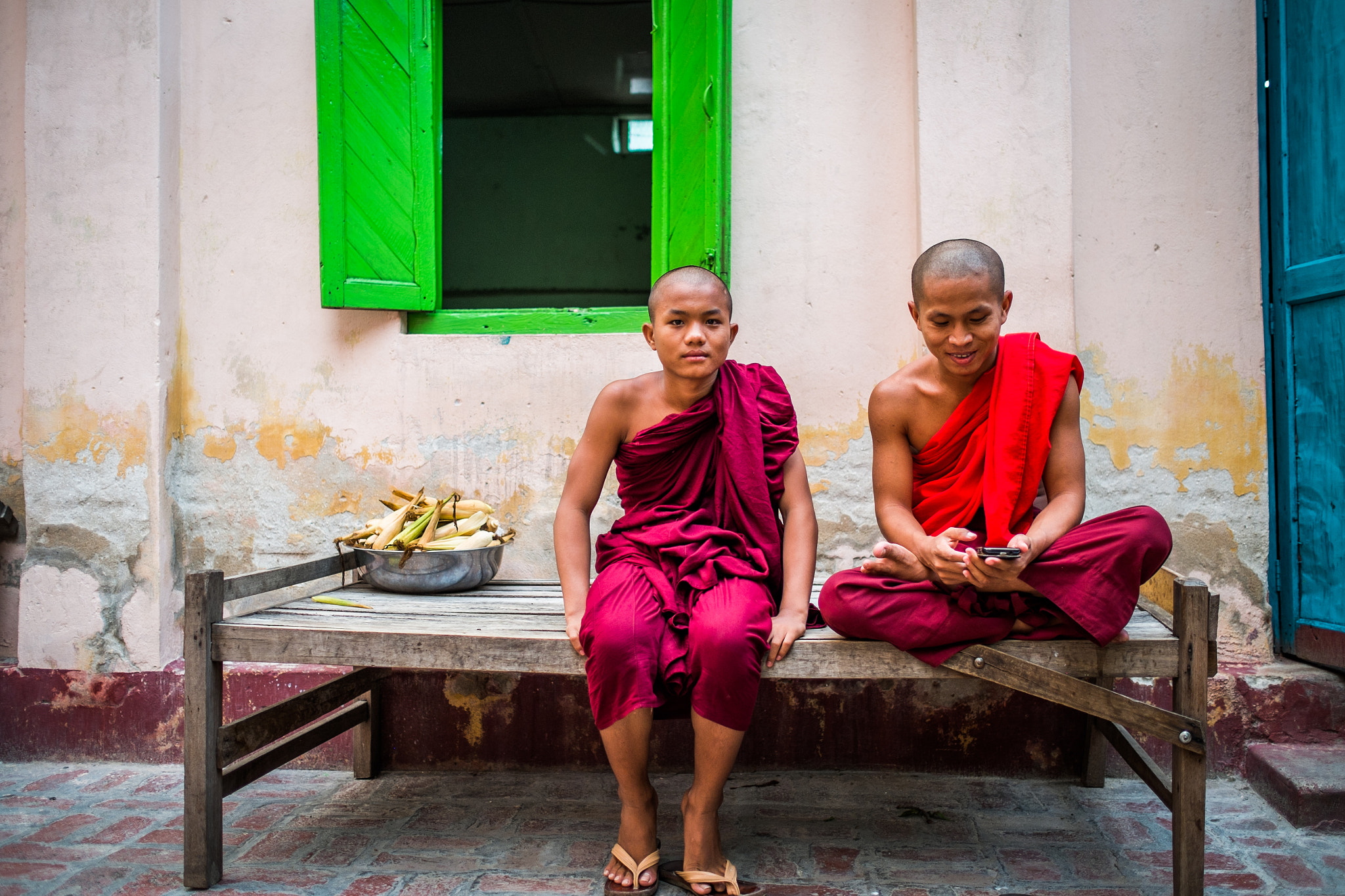 Fujifilm X-E1 + Fujifilm XF 23mm F1.4 R sample photo. Novice monks with iphone in mandalay, myanmar photography