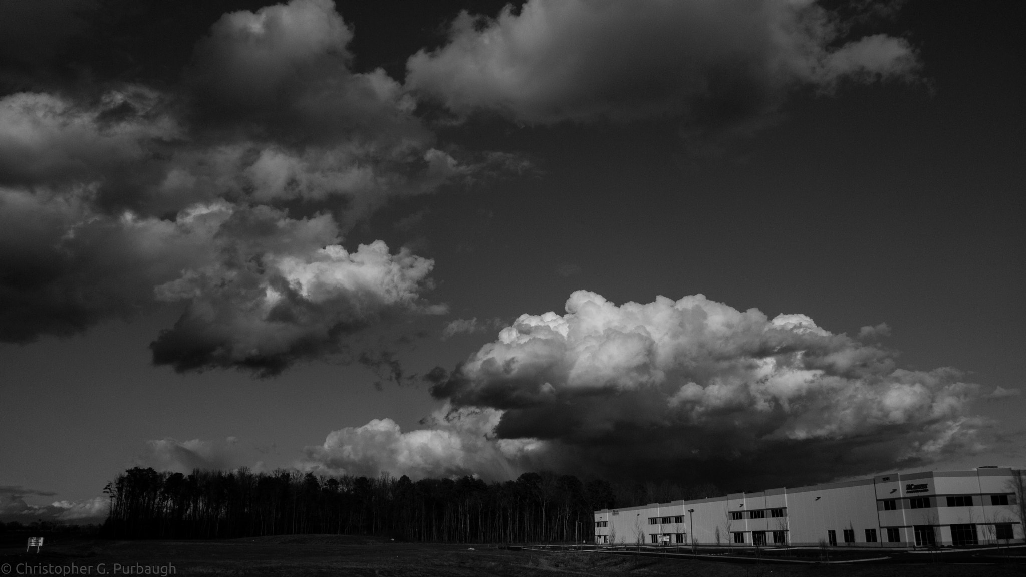 Olympus PEN E-P2 sample photo. Clouds in monochrome photography