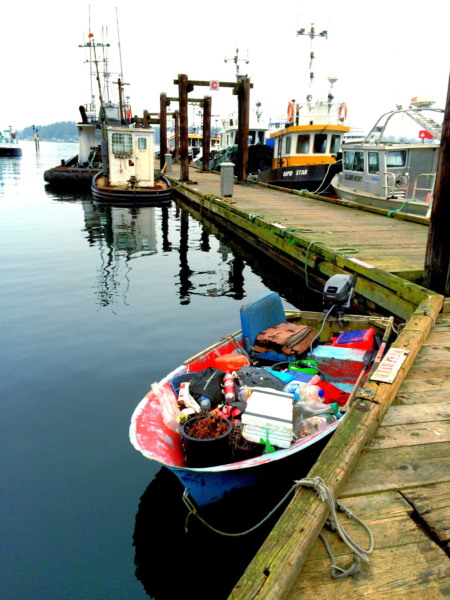 Apple iPhone6,1 sample photo. Skiff full of junk. nanaimo harbour, vancouver island, bc, canada. photography