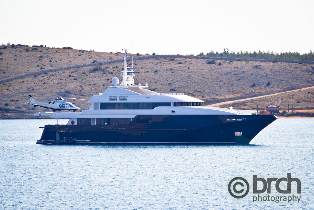 Loxury yacht with helicopter onboard