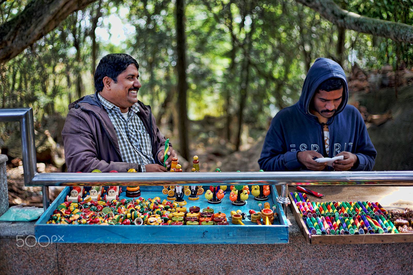 50mm F1.8 sample photo. Toy seller photography