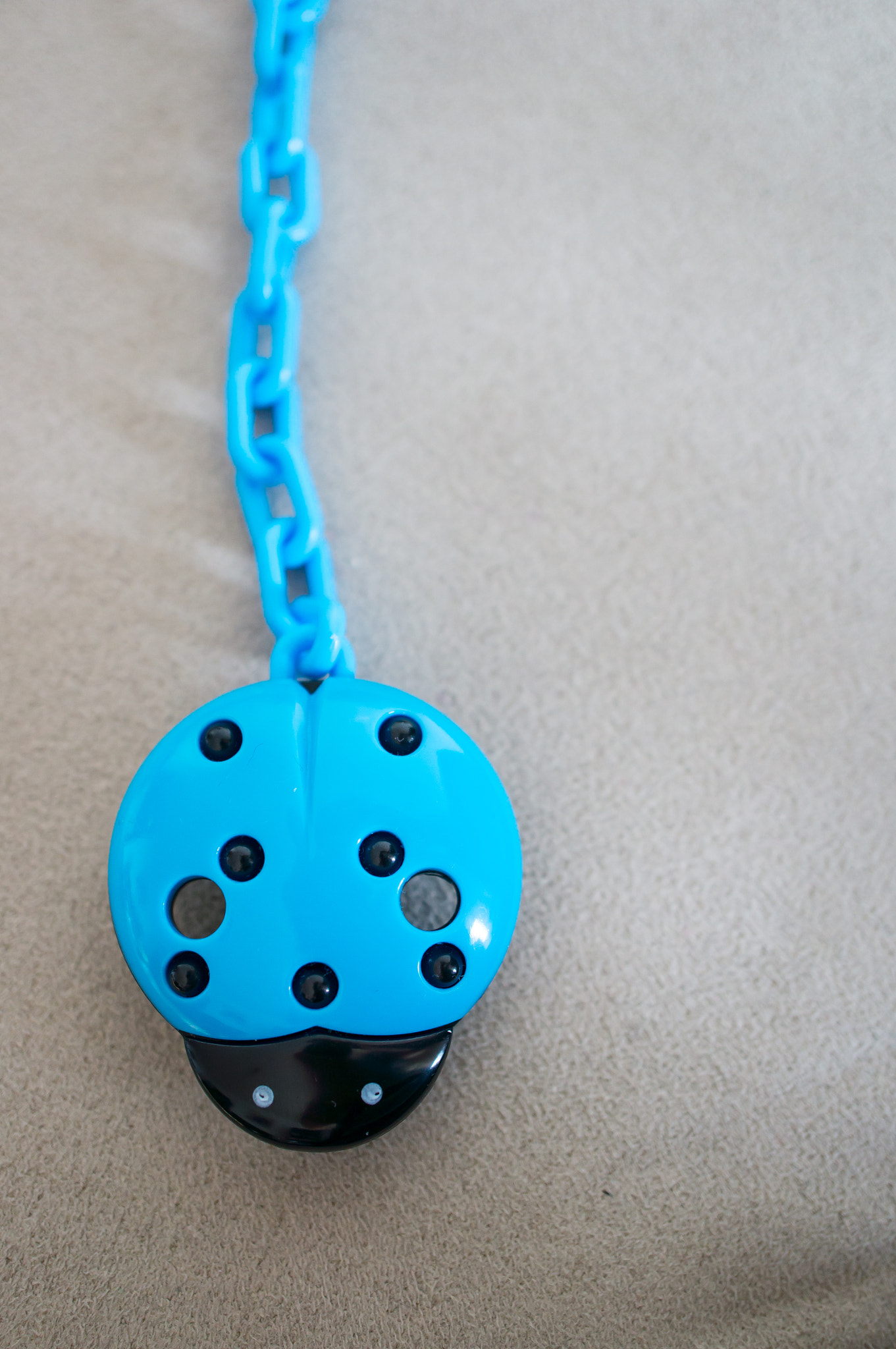 Sony Alpha NEX-5N + Sony E 30mm F3.5 Macro sample photo. Baby pacifier hanger photography