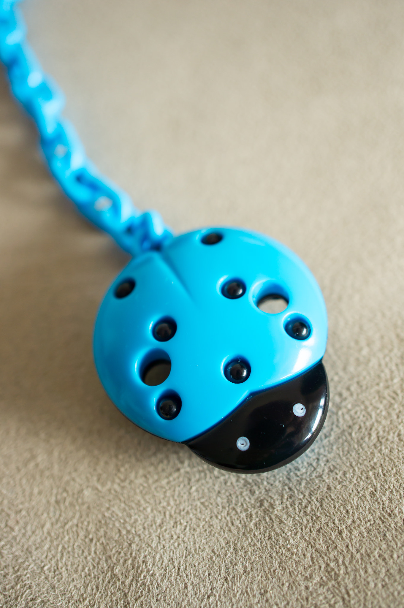 Sony Alpha NEX-5N + Sony E 30mm F3.5 Macro sample photo. Baby pacifier hanger photography