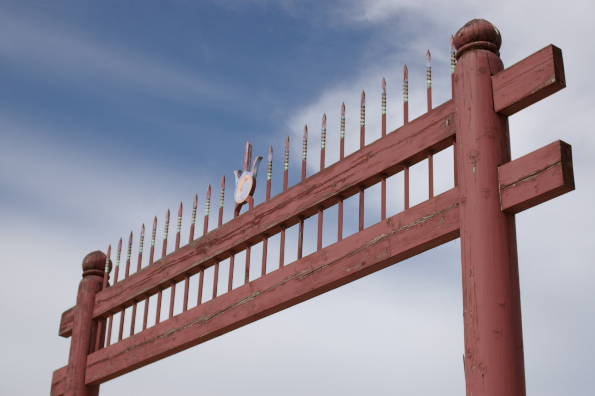 Pentax *ist DS sample photo. A red gate with spiked top photography