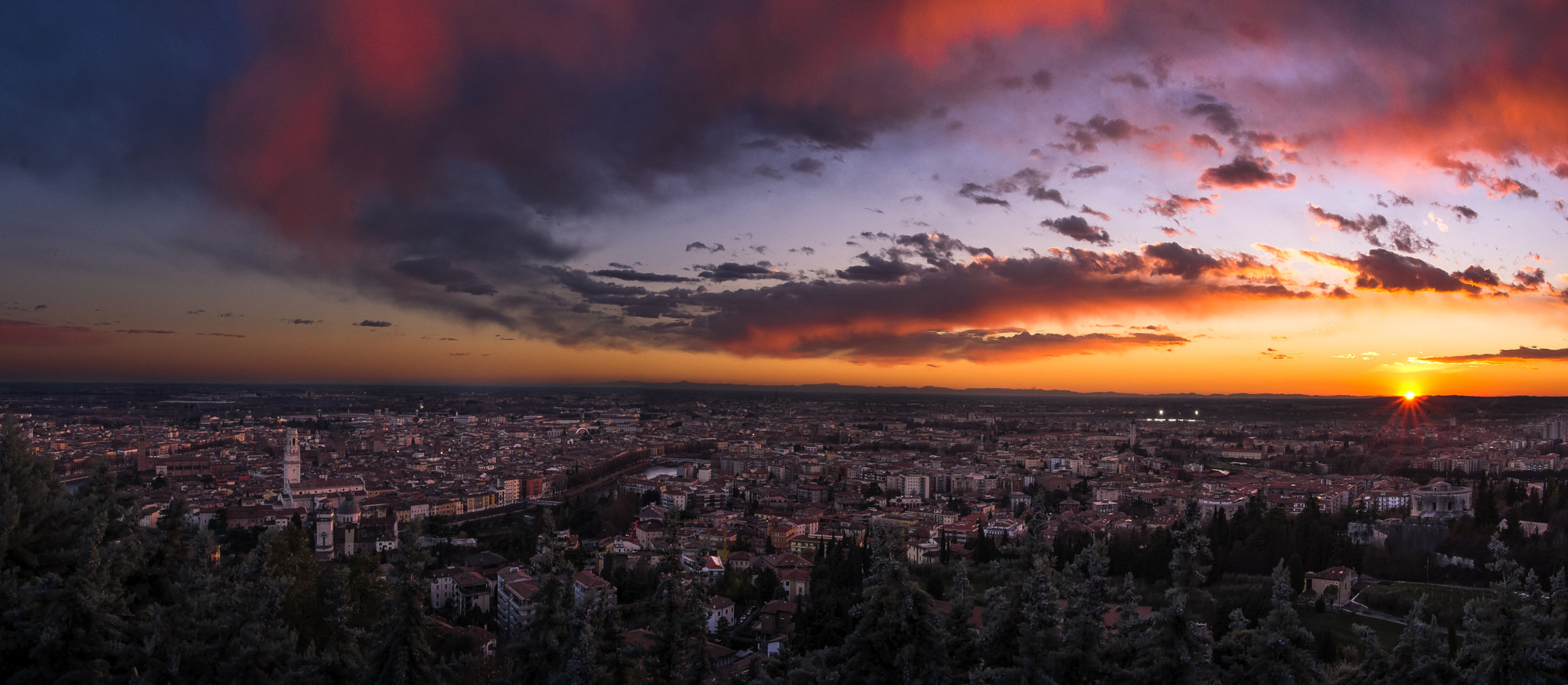 Fujifilm X-Pro1 + Fujifilm XC 16-50mm F3.5-5.6 OIS II sample photo. Verona covered by colorful clouds photography
