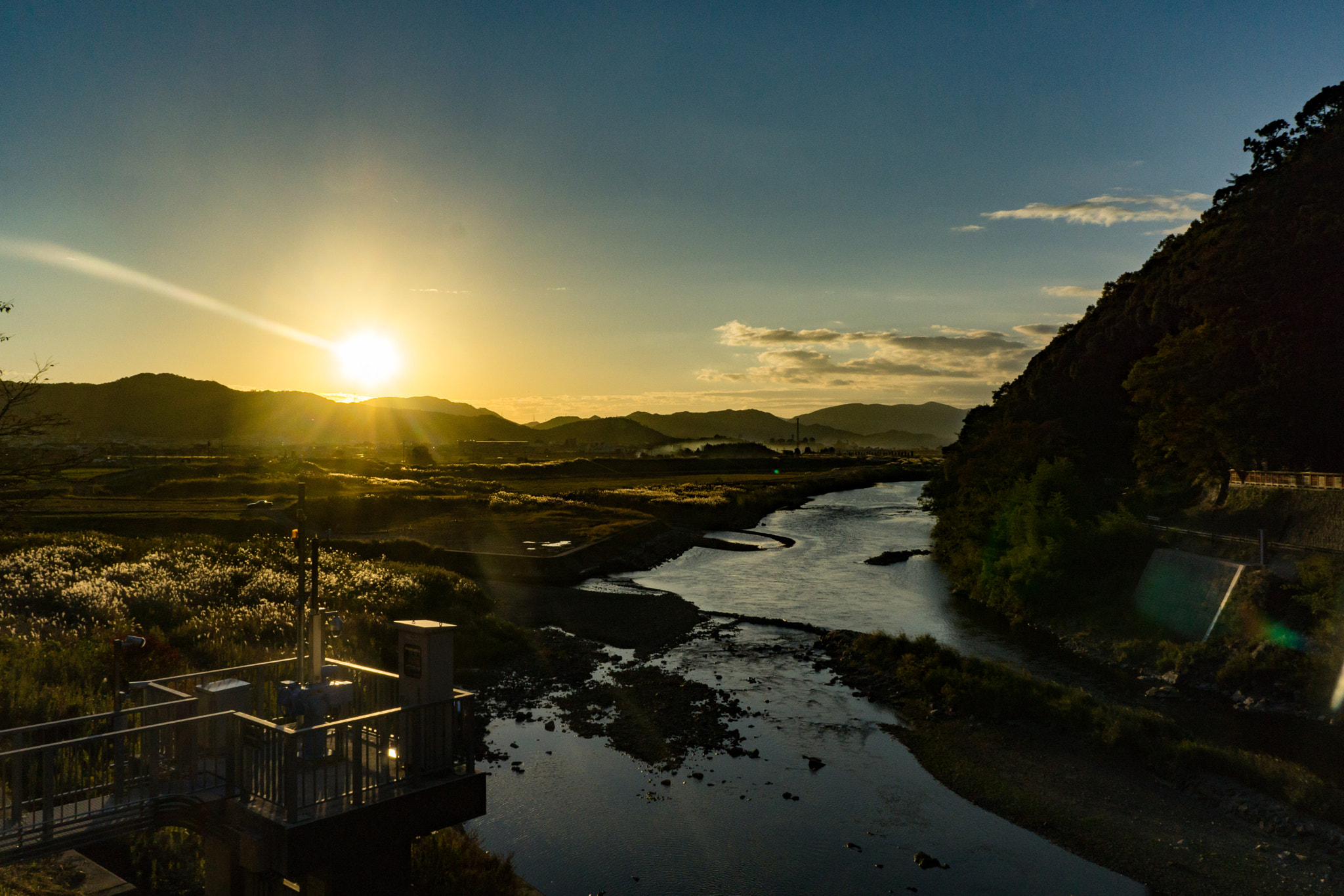 Sony a5100 + Sony E 18-55mm F3.5-5.6 OSS sample photo. Sunset from the sagano scenic train photography